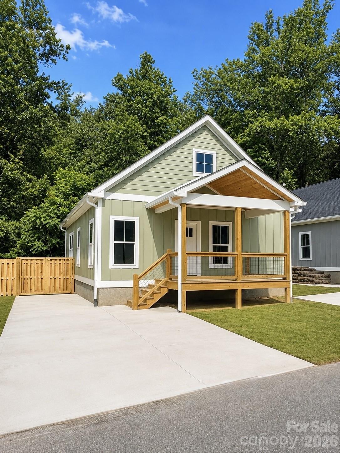 110 Orchard Street Adventure and affordability meet just 20 minutes from Asheville! This newly built 2BR/2BA home in Old Fort puts you steps from trailheads, cycling routes, and local dining and breweries - perfect for active living or a weekend escape. Flexible live/work or small professional use adds versatility beyond a traditional residence. Finished in crisp white board-and-batten, the home features a functional layout, city water/sewer, covered front porch, back deck, stand-up attic, privacy fence, and dual off-street parking. A charming small stream adds natural ambiance, while the low-maintenance yard keeps life simple. The property also offers short- or mid-term rental potential in a supply-constrained market. Owner/broker. Exterior highlights include: Covered front porch Private back deck Fully fenced yard Easy-care, level lot Large driveway for plenty of parking Located in the heart of Old Fort, you’re just a short walk or ride to local restaurants, breweries, and shops — and only 20 minutes to Asheville. No HOA. STR-friendly. Broker-owned.