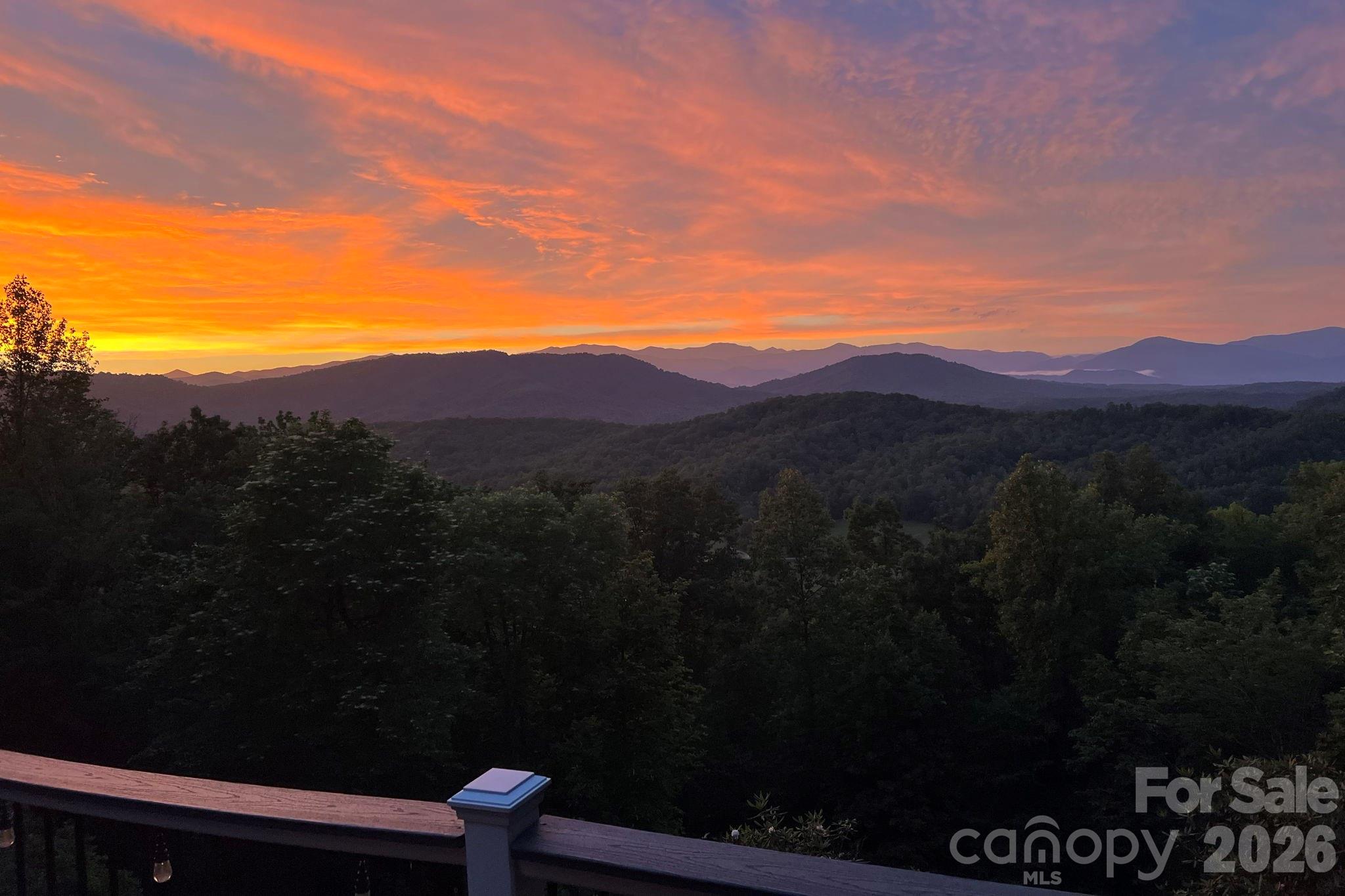 Exceptional mountain retreat offering breathtaking long-range Blue Ridge Mountain views, unmatched privacy, and 52± wooded acres with the potential for multiple additional homesites. This well-maintained brick home features 4 bedrooms, 3 full baths, a new roof, a freshly painted interior, new granite countertops in the kitchen, and new tile flooring in the kitchen and primary bathroom. The spacious sunroom and expansive Trex deck are perfectly positioned to capture spectacular year-round mountain vistas and unforgettable sunsets. A nearly 800-square-foot detached four-car garage provides ample space for vehicles, equipment, hobbies, or a workshop and includes additional walk-in storage above. The surrounding acreage offers endless opportunities for hiking, hunting, ATV trails, recreation, or future development. Whether you’re searching for a private mountain estate, family retreat, or investment with expansion potential, this extraordinary property offers a rare combination of panoramic views, usable acreage, and timeless appeal just minutes from Old Fort and a short drive to Black Mountain and Asheville.