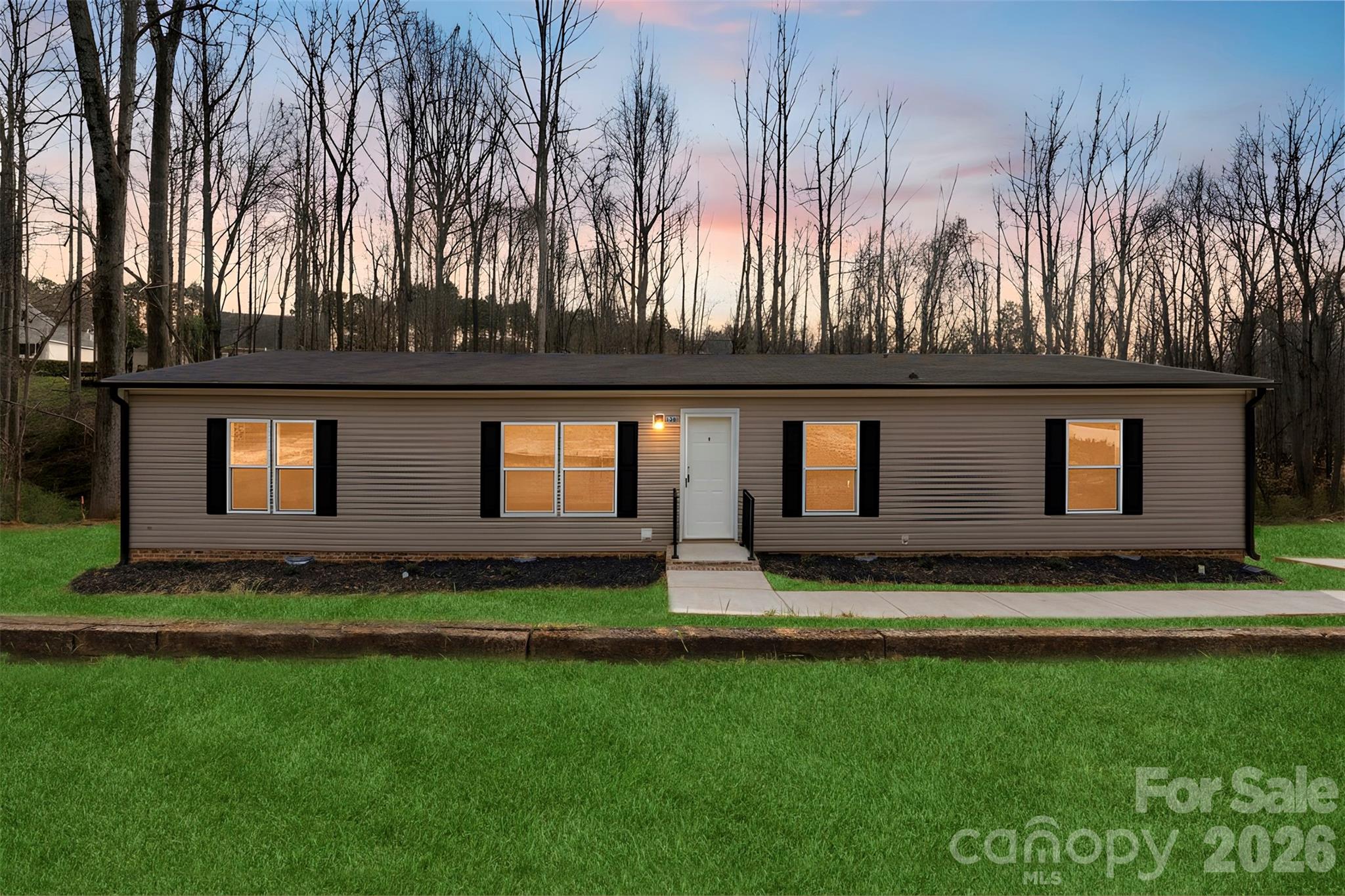 “Perfect Location Near Lake Norman! Situated on a spacious 1.46-acre lot, this beautiful property offers proximity to Lake Norman’s shopping, dining, and downtown Mooresville. The Phoenix model by Cavco features a modern open concept layout with 3 bedrooms, and 2 full baths across 1,680 sq ft of living space. The home boasts a large living room perfect for entertaining, a modern kitchen with LED lighting and appliances, and a utility room for added convenience. The primary suite includes an en-suite bathroom with a separate tub and shower. A new concrete driveway and a deck will be added, completing this move-in-ready gem!”  There are 5 units available in this neighborhood reach out today before it is too late!