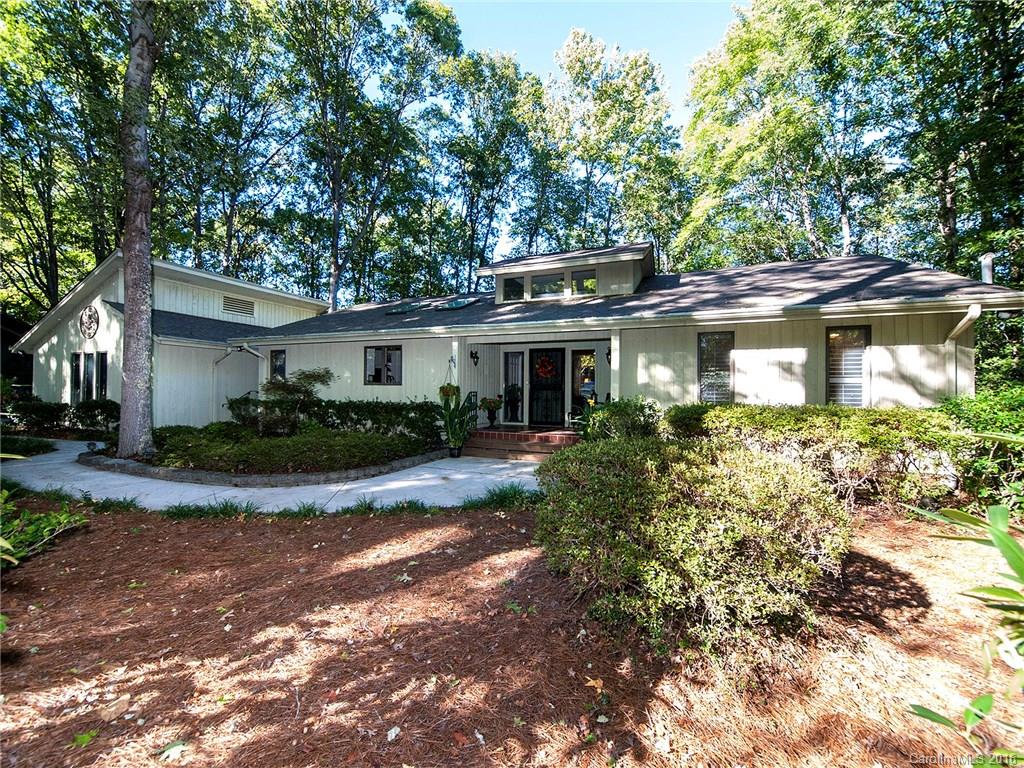 Do not miss this opportunity!! This lovely home has many unique features. Socialize with friends and family around a beautiful granite island in a renovated kitchen. Enjoy a lg great room/dining room/sunroom with access to decking. Retreat into owner's suite for privacy with an office and a spa like master bath on the main level. Lower level features two full baths and bedrooms, a huge family room with  fireplace. Second office down. Lots of storage. Wonderful wooded views. Cul de sac location.