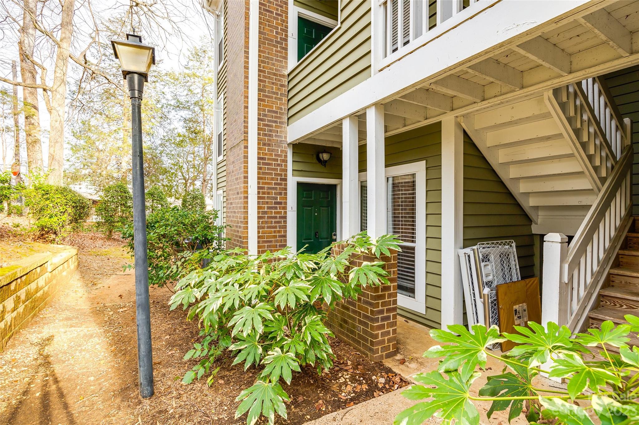 Beautifully updated condo in the heart of Elizabeth/Eastover at The Villages of Eastover Glen! Stepping into this spacious 2 bedroom, 2 bath conveniently located on the first floor, you’ll find all modern updates with a warm homie feel. The floors have been updated with dark hardwoods throughout and updated paint in 2021. The open concept to the kitchen which has new appliances as of 2023. End your days in the spa like bathrooms which have been updated with new tile flooring, board and batten accents in primary with extra linen closet, and new vanity in guest bathroom in 2022. Step out back to your private covered porch with a gate to the private grass area partially fence behind.  Easily accessible extra storage closet for all your outdoor accessories. Conveniently located near restaurants, grocery, and the Mint Museum. Condo amenities make it hard to leave with pool, club house and gym.  You’re not going to want to miss this opportunity to own your own private condo in Charlotte!