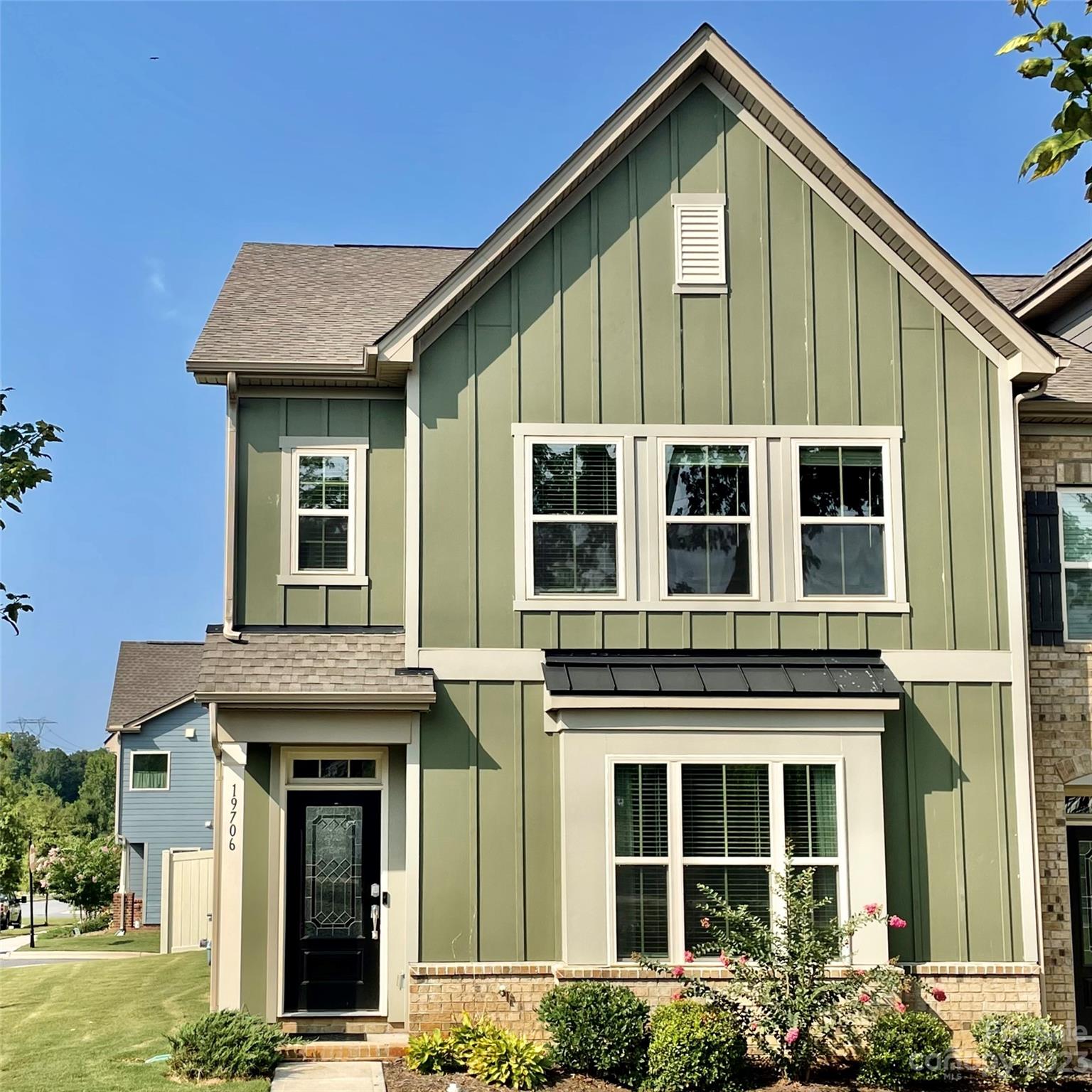 WELCOME HOME! This Move-In Ready End-Unit townhome is the largest townhome floor plan offered (the Thatcher).  2450+ sq ft, 3 bedrooms, 3.5 baths & loft/flex space. This home features 2 spacious primary bedrooms (main & upper level), each with a walk-in closet & ensuite bathroom featuring dual vanities, walk-in shower, bathtub & tile floors. Inviting open concept floor plan on main level with wood floors & lots of windows for natural light. Gourmet kitchen is heart of home overlooking dining area & great room and boasts quartz counters, white cabinets, huge island & SS appliances including 5 burner gas range. Fenced backyard.  Mowing included in HOA dues! Community amenities include an incredible clubhouse, pool & walking trails. Convenient to The Greenway's paved path which leads to Historic Downtown Davidson. Also, Plum Creek Park's playground, tennis & basketball courts.  Mins away from the highly desirable school system, Lake Norman, I-77, shopping, dining and more.