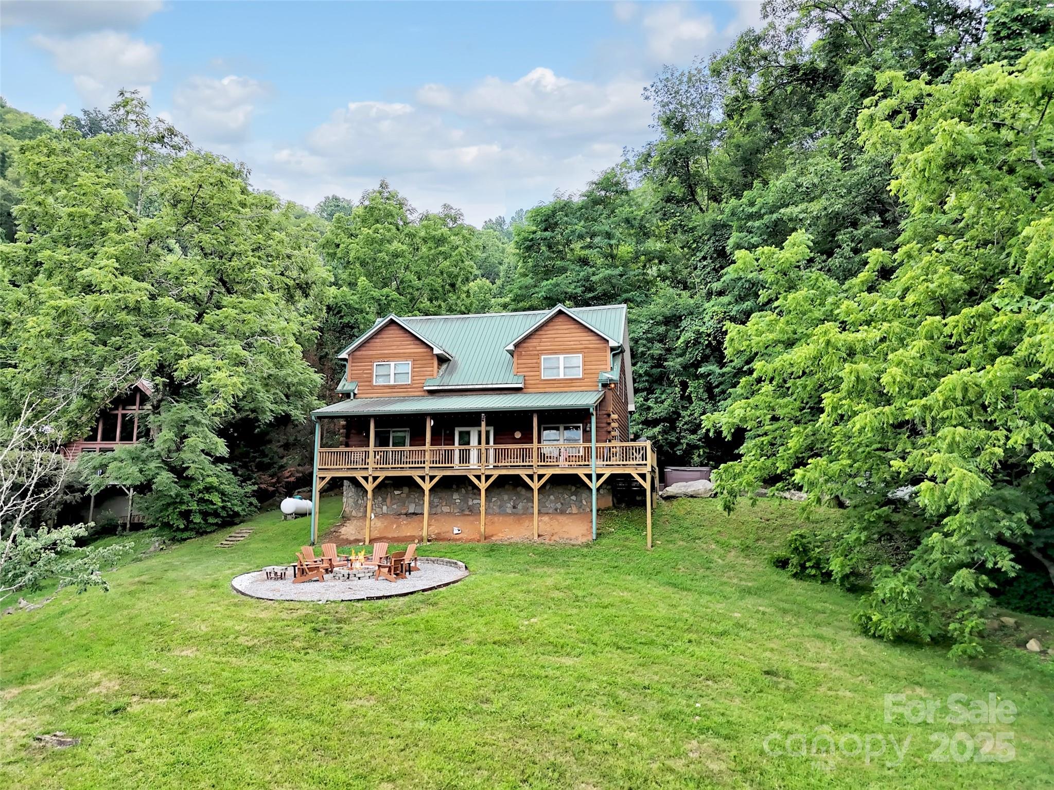 Serene Smoky Mountains Retreat   Perfect for Vacation or Investment!

Welcome to your dream mountain escape! Nestled in the heart of Western North Carolina's Great Smoky Mountains, this charming 3-bedroom, 2.5-bath log cabin spans 1,800 square feet of rustic elegance and tranquil living. Surrounded by lush forest and abundant wildlife including elk and even the occasional bear this home is an ideal sanctuary for nature lovers.

Enjoy sweeping long range mountain views from expansive covered decks, and gather around the fire pit for cozy evenings under the stars. Whether you're sipping coffee at sunrise or stargazing in solitude, this property offers unmatched peace and privacy.

Perfectly positioned for adventure and relaxation, you're just a short drive to vibrant Asheville and scenic Gatlinburg, making it a prime spot for a second home, vacation getaway, or high-performing rental investment.

Don’t miss out on this rare opportunity to own a slice of mountain paradise!
