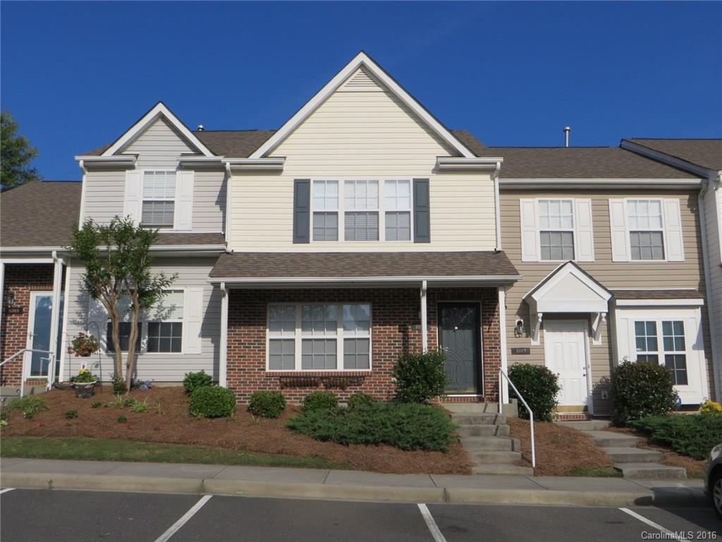 This town home boasts a spacious living/dining area w/attractive wood laminate flooring, corner fireplace & triple windows that make it light & bright. Eat-in Kitchen has good cabinet/counter space, recessed lighting & upgraded drop pendant lighting over center work island. French doors lead to private rear  patio, outside storage closet. Two vaulted Masters up, each w/private bath & deep WICs - perfect for guests, roommates. Glass etched storm door. Front porch. Quick walk to the community pool