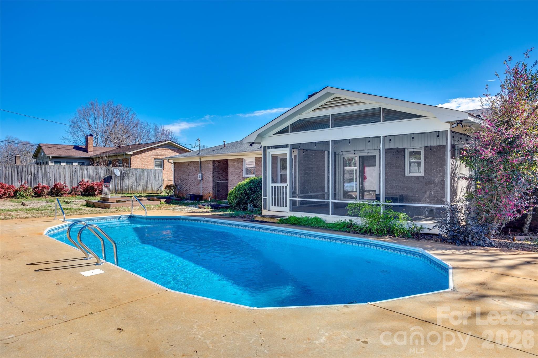 Charming 3-bedroom, 2-bath brick ranch offering comfortable single-level living. This home features a spacious layout, abundant natural light, and classic brick exterior for timeless curb appeal. Enjoy outdoor living on the screened-in back porch overlooking a fully fenced yard—ideal for relaxing or entertaining. The backyard also includes a pool, with owner-paid pool maintenance provided during pool season from Memorial Day through Labor Day.

Additional features include a carport for covered parking, with laundry facilities conveniently located in a designated room within the carport. Designed for easy living with thoughtful indoor-outdoor flow, this home offers both privacy and functionality in a desirable setting.
