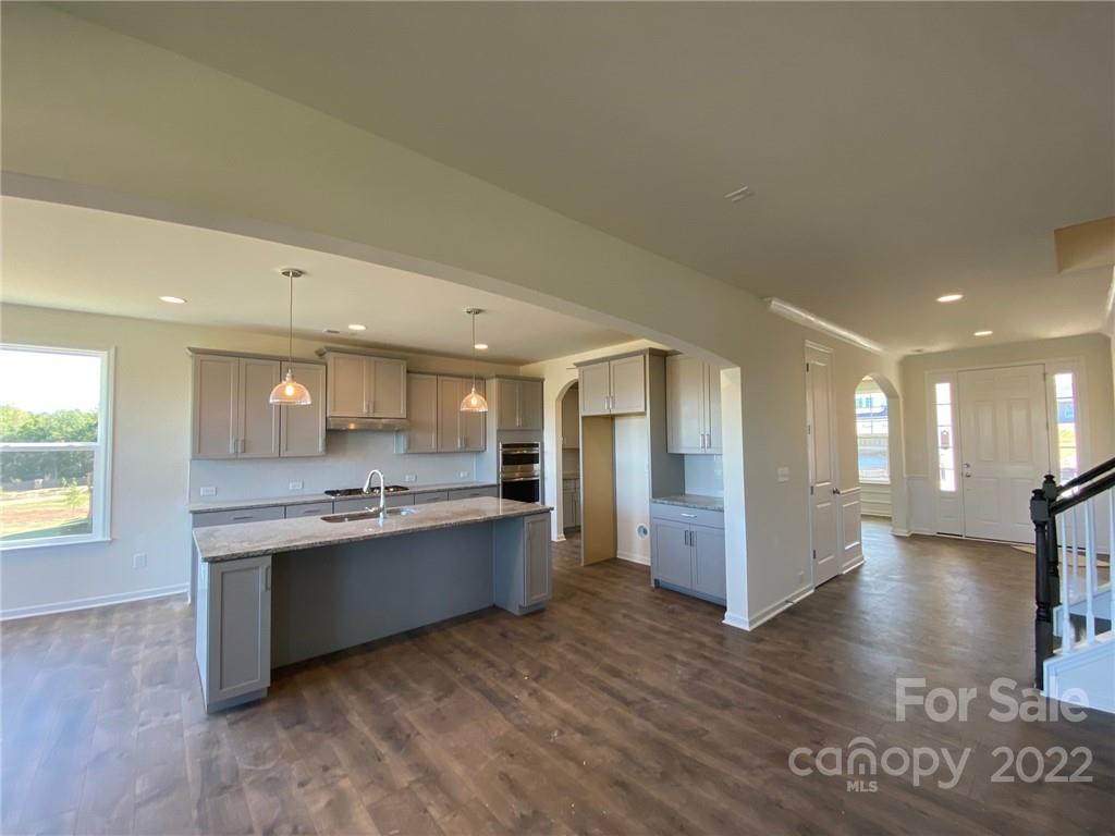 MLS # 3863083 ~ REPRESENTATIVE PHOTOS ADDED. Winter Completion! This beautiful new construction is ready to be your brand new home! This perfect size, floor plan offers four bedrooms, three baths with a guest suite down. The large kitchen with butler's pantry opens up to a spacious family room with fireplace and breakfast area. This home will also have a formal dining room and bonus room. Our Eastover plan is finished with a drop zone off the garage, upgraded selections in the main living areas and oak treads on the stairs. Structural options added at 1016 Harbor Bay Drive include: tray ceilings, tub and shower at owner's, rear screened deck, additional windows at bath 2 and breakfast, fireplace, crawl space, and gourmet kitchen.