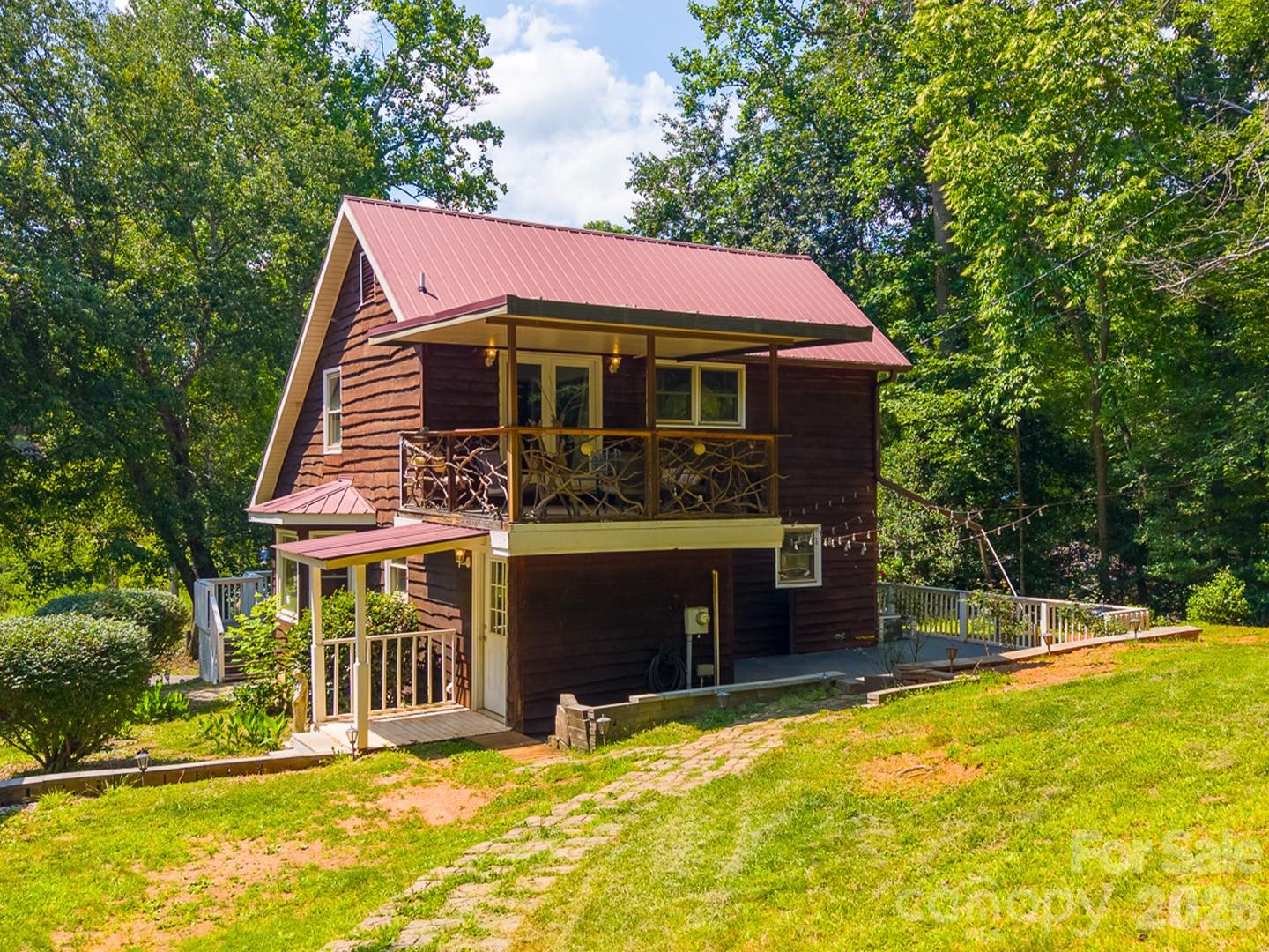 OPEN HOUSE | SATURDAY, JULY 18 | 12:00 - 3:00 PM

Charming rustic cabin-style retreat tucked away on a quiet cul-de-sac in the Cowee community, just minutes from downtown Franklin. This 2 bed, 2 bath home offers 1,399 sq ft of cozy, character-filled living on just under an acre. A wood-burning fireplace anchors the living space, perfect for cool mountain evenings, while the deck/porch extends your living area outdoors to soak in the peaceful, wooded surroundings. Located in the historic Cowee area known for its mountain views, and proximity to the Little Tennessee River and Nantahala National Forest. This home is ideal as a full-time residence for anyone seeking small-town charm with easy access to Franklin's shops, restaurants, and outdoor recreation.