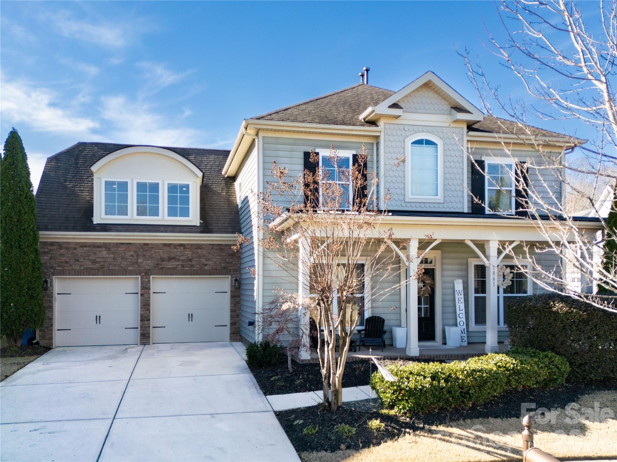 Welcome to 1861 Felts Parkway, an impeccably updated 5-bedroom, 3-bathroom residence spanning 2,820 square feet, ideally situated in the vibrant Massey community of Fort Mill and served by award-winning schools. This home combines timeless design with modern luxury, offering a highly desirable floor plan that includes a main-level bedroom and full bath, perfect for guests, multigenerational living, or a private office suite. 

At the heart of the home is a stunning open-concept kitchen designed for both everyday living and elevated entertaining. Thoughtful upgrades include new custom cabinetry, quartz countertops, a designer backsplash, and an oversized island featuring an apron-front sink, wine refrigerator, mini refrigerator, and microwave drawer. Upgraded appliances and a spacious eat-in area complete the space, which flows effortlessly into the main living area highlighted by a gas fireplace creating warmth and sophistication. A separate flex or dining room adds versatility for formal gatherings or refined work-from-home needs.

Recent enhancements include fresh interior paint & fixtures, hardwood flooring on the stairs, new flooring on the upper level, and a custom-designed primary closet, reflecting attention to detail and elevated finishes throughout. The upper level offers a serene primary suite and generously sized secondary bedrooms designed for comfort and style. 2 of the additional bedrooms have walk-in closets with customized storage. 

Need space to spread out? This home offers a flex space on the main level, perfect for play, study, hobbies or dining. A generous bonus room (approx. 400 sq ft) has endless possibilities as extra office spaces, entertainment, a 6th bedroom , ready for you to personalize. And be sure to check out the attached garage with hanging shelving and extended cabinetry.

Step outside and enjoy resort-inspired amenities just steps from your door, including a clubhouse, pool with lazy river, giant slide, playground, fitness center, and community center, along with sidewalks and scenic walking trails that define the Massey lifestyle. Many neighborhood social activites are offered throughout the year.

Conveniently located near shopping, dining, and major commuter routes, this move-in-ready home delivers refined living, exceptional amenities, and an unmatched sense of community in one of Fort Mill’s most sought-after neighborhoods. Schedule your showing now.