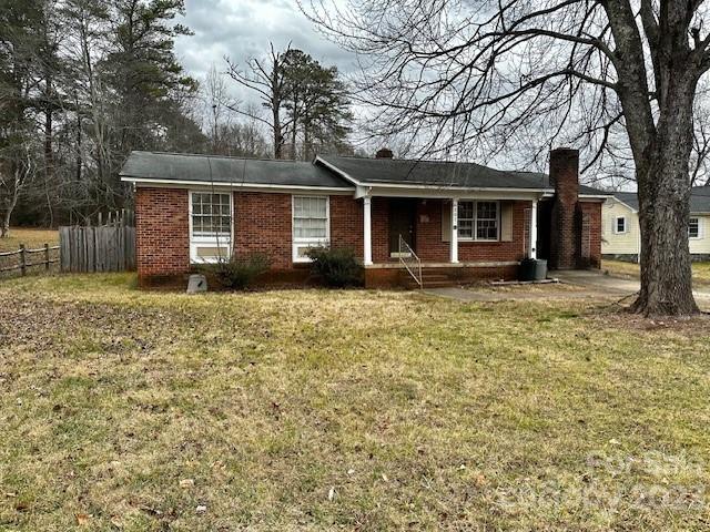 Fantastic value in this one-level 3-bedroom, 1.5-bath full-brick home. Great location very close to Downtown Morganton! The home offers real hardwood floors, a new vapor barrier in the crawl space, and new carpet in the den. There is a private half bath off the primary bedroom. Open concept living and dining area, along with a large den with a wood-burning fireplace. You will love the spacious tiled step-in shower in the full bath. Find ample storage space in the laundry room. Great flat backyard that is fenced in! Sold as-is.