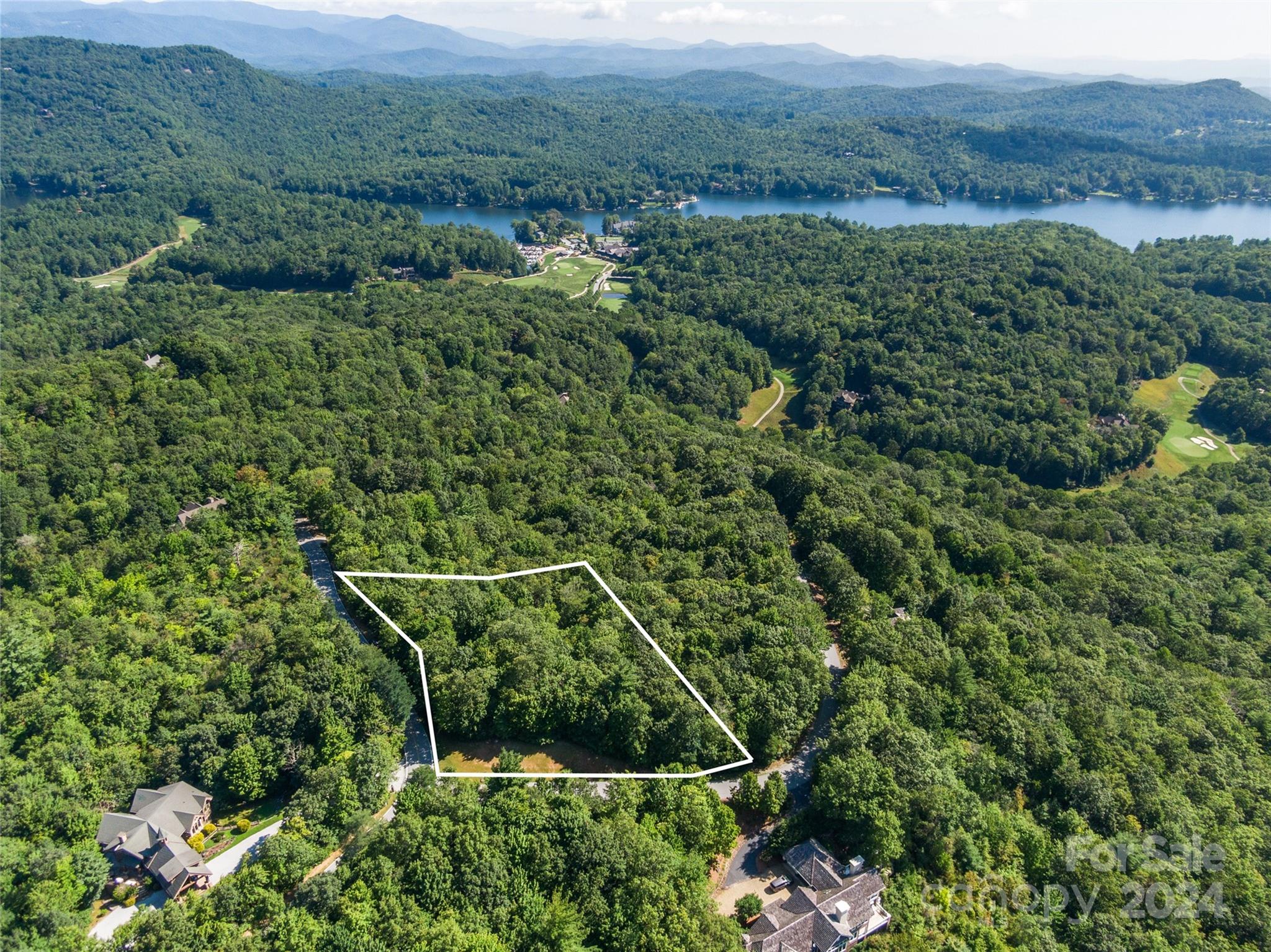 Wooded mountain lot in the Lake Toxaway Estates ideally suited for your building needs.  This property is perfectly situated along Toxaway Court and Toxaway Trace, convenient to the Country Club, Golfing, Tennis and the Marina.
