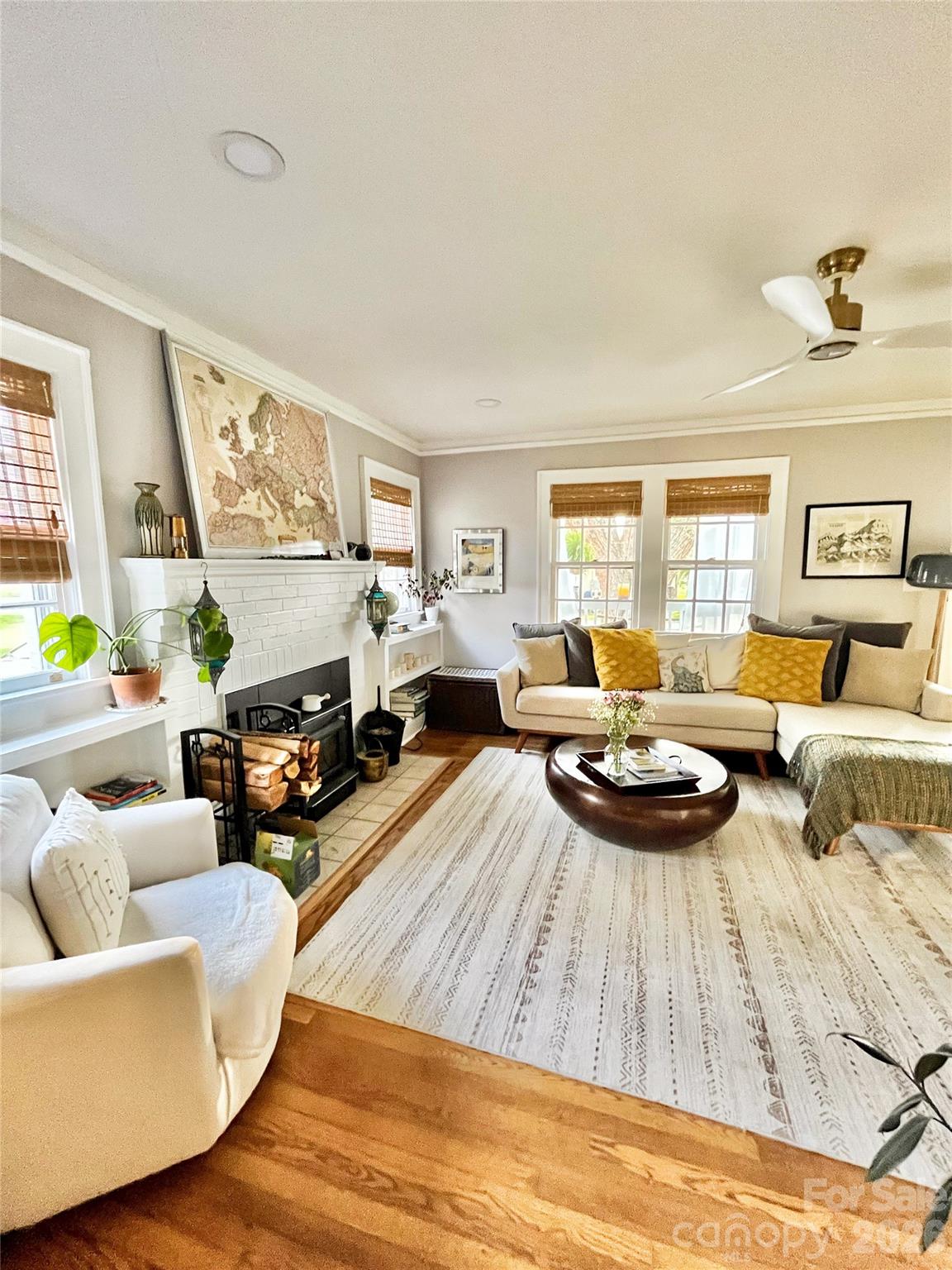 Overflowing with charm and priced to move, this well-maintained 3BR/2BA home blends style, comfort, and thoughtful updates. Located just over a mile from Downtown Waynesville and near the Country Club, this is an opportunity you don’t want to miss.

From the moment you arrive, the inviting covered front porch sets the tone with year-round mountain views, perfect for morning coffee or relaxing sunsets. Inside, you’ll find fresh paint, artistic touches, and updated finishes that make this home truly stand out.

The main home features two bedrooms and a full bath, while a private rear suite with its own bedroom and bath offers ideal guest accommodations or excellent Airbnb potential. A cozy living room with a wood-burning fireplace and a bright kitchen create a warm, welcoming feel, complemented by a dedicated laundry area with sink for added convenience.

Outside, enjoy a fenced backyard and patio perfect for pets or entertaining, along with a carport, storage, and private driveway.

This lovingly cared-for home is full of personality and potential, with a seller welcome to consider all reasonable offers, this is your chance!