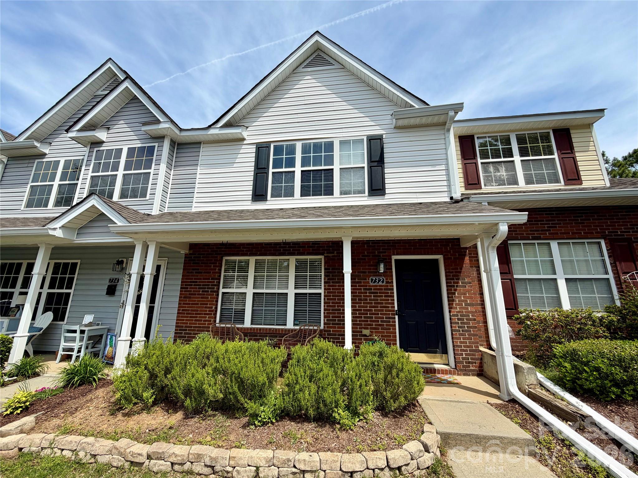 Discover this updated 2 bedroom 2.5 bath move-in ready 2 story townhome in the award-winning Fort Mill school district! A covered front porch leads you inside to an open floorplan featuring abundant natural light & low maintenance newer luxury vinyl flooring. The chef's kitchen is a highlight showcasing new quartz countertops, kitchen island, painted custom cabinets & a new stainless steel refrigerator & stove. Bright and open living room with gas fireplace flows naturally into the dining area. Upstairs offers two spacious bedroom suites with vaulted ceilings both with private en suite baths & walk-in closets. Enjoy private outdoor living on the expanded back patio. Plenty of parking: 2 dedicated parking spots & overflow visitor spots. Large community pool for those fun summer months. Convenient to great shopping, dining, interstates & downtown Pineville. A rare gem!