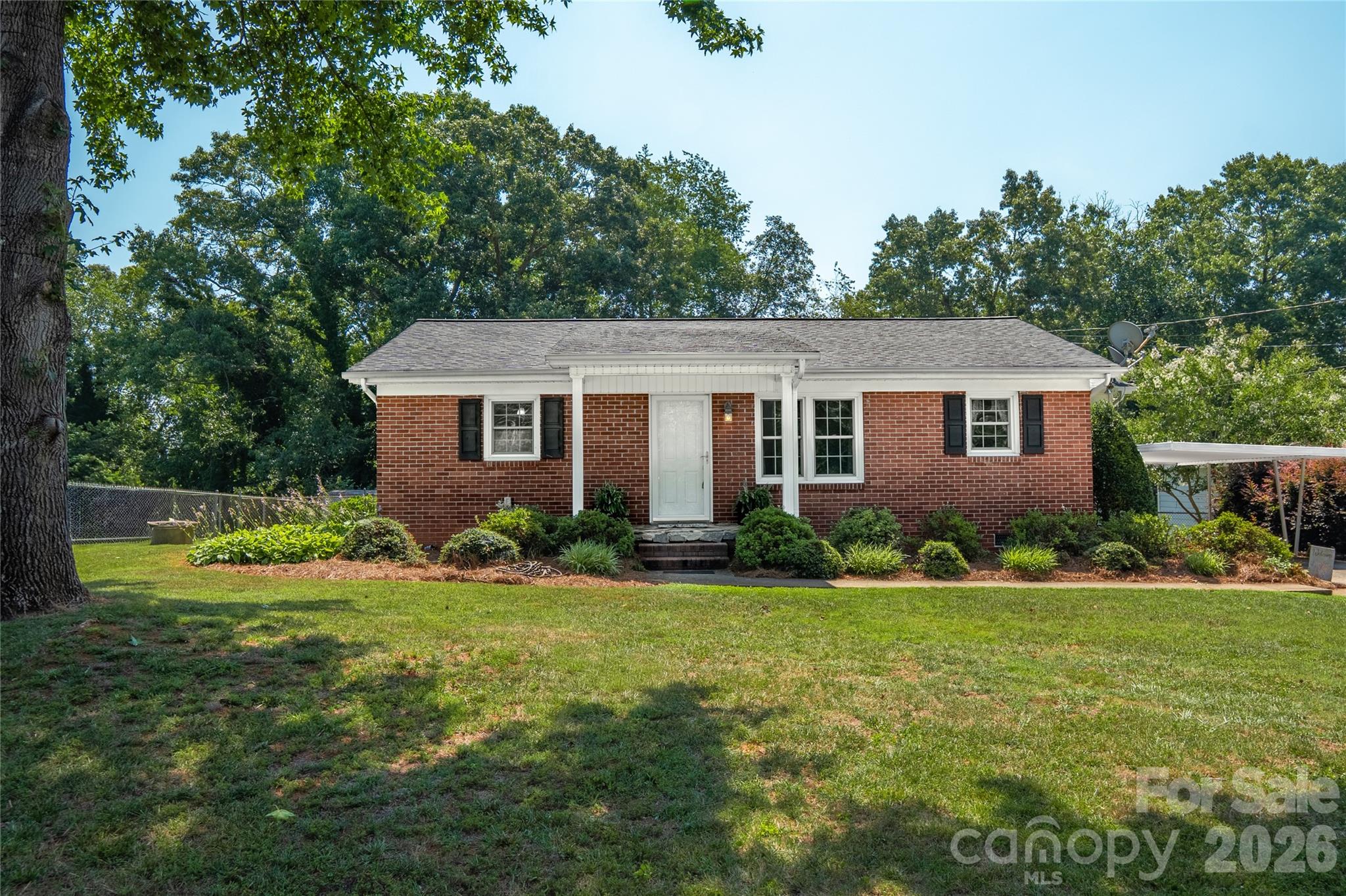 Carolina on your mind? Then you have to see this 3/BD/2BA Ranch waiting for you to call it home! Covered front porch welcomes you inside to a family room and dining room featuring hardwood floors! Kitchen has ample cabinets and a pantry with all appliances to convey! There is a flex space next to the kitchen that could be an office. Primary bedroom has a primary full bath with shower only. The 2 other bedrooms are a good size. Full bath has tub/shower for family and guests. Sun Porch off of the kitchen has W/D hookups, and the W/D conveys. Nestled on .50 acres with fenced backyard and side yards! 12x16 storage building conveys! Metal carport, concrete drive, and more! Conveniently located to major highways, shopping, restaurants! Perfect for the first time home Buyer, or someone wanting to downsize! New paint and carpet! Schedule your appointment to see this one soon!