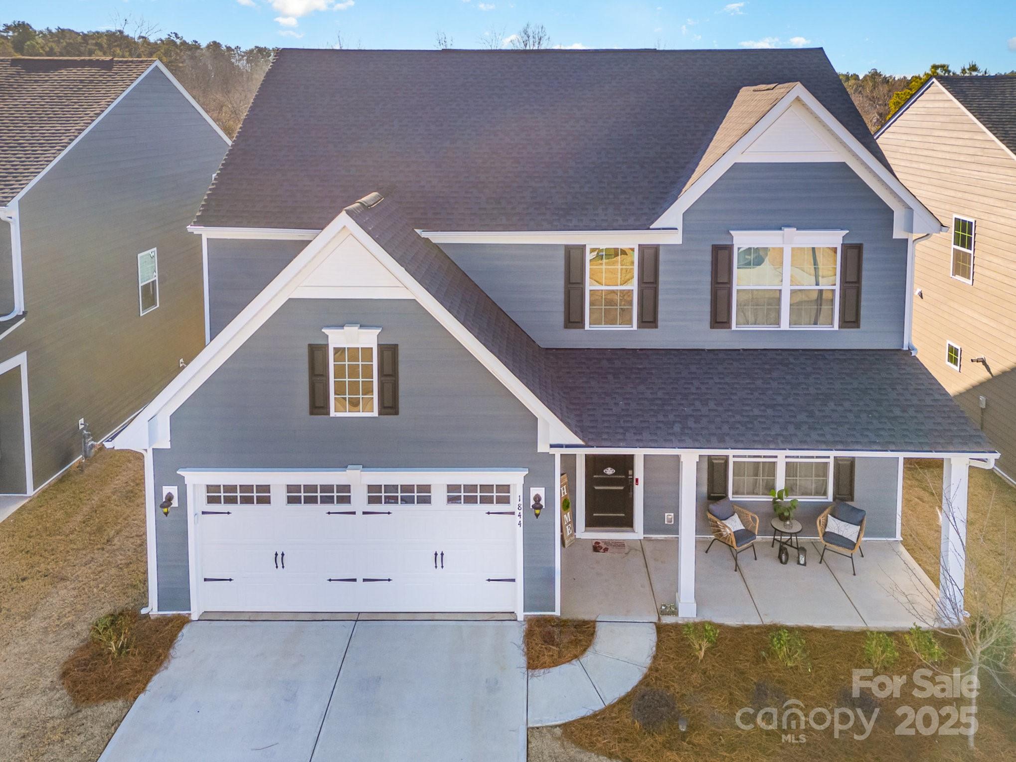 This nearly new 2-story home, built in 2023, offers a thoughtfully designed floor plan with 3 spacious bedrooms & office/nursery bonus room upstairs w/ loft. The main-level primary suite features a luxurious en-suite bath w/ dual vanities, a large custom walk-in closet, & upgraded finishes. The heart of the home is the stunning kitchen with white cabinetry, upgraded black hardware, a large island, & a spacious dining area, perfect for gatherings. The open-concept living area includes a cozy fireplace, large windows & custom acccent wall. Upgrades include fresh new paint throughout, custom lighting, & a stylish half bath featuring unique Gucci wallpaper. The custom-designed laundry room provides ample storage with added cabinetry, and the bar area features floating shelves and a butcher block countertop. Low maintenance living w/ HOA covering law maintenance!  Located just minutes from Monroe Country Club, Hwy 601, Lake Lee, & downtown Monroe, this home offers luxury & prime location.