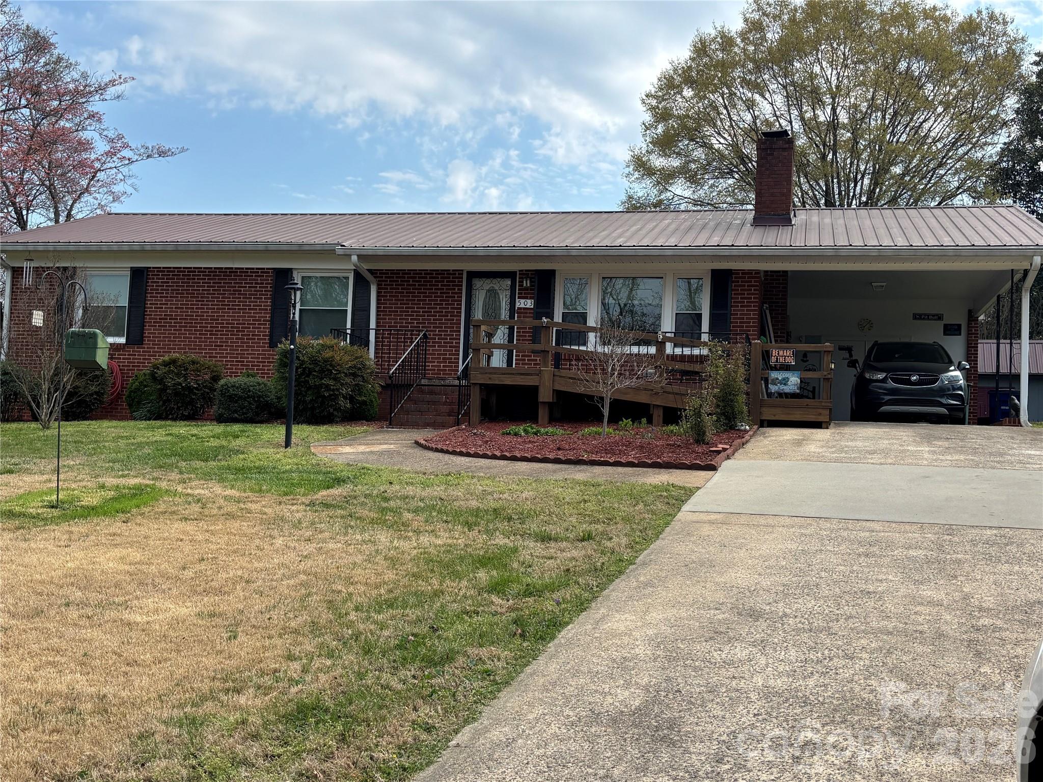 Over 1600 sqft of living space!
Step into this beautifully preserved 1962 brick ranch where classic charm meets thoughtful functionality. Immaculately maintained, this home showcases original hardwood floors and stunning, well-preserved vintage tile bathrooms that offer a timeless nod to its era. The inviting sun porch provides the perfect transition into a private mother-in-law suite, ideal for extended family, guests, or flexible living arrangements. With dual laundry areas, convenience is built right in. Pet lovers will appreciate the uniquely crafted, solid built-in pet doors are just one example of the thoughtful details throughout. A detached workshop offers additional space for hobbies, storage, or creative projects.

Every inch of this home reflects pride of ownership. Clean, charming, and exceptionally well cared for, this is a rare opportunity to own a truly special property with character you simply can’t recreate. The backyard has decorative fencing as well as an underground system.
