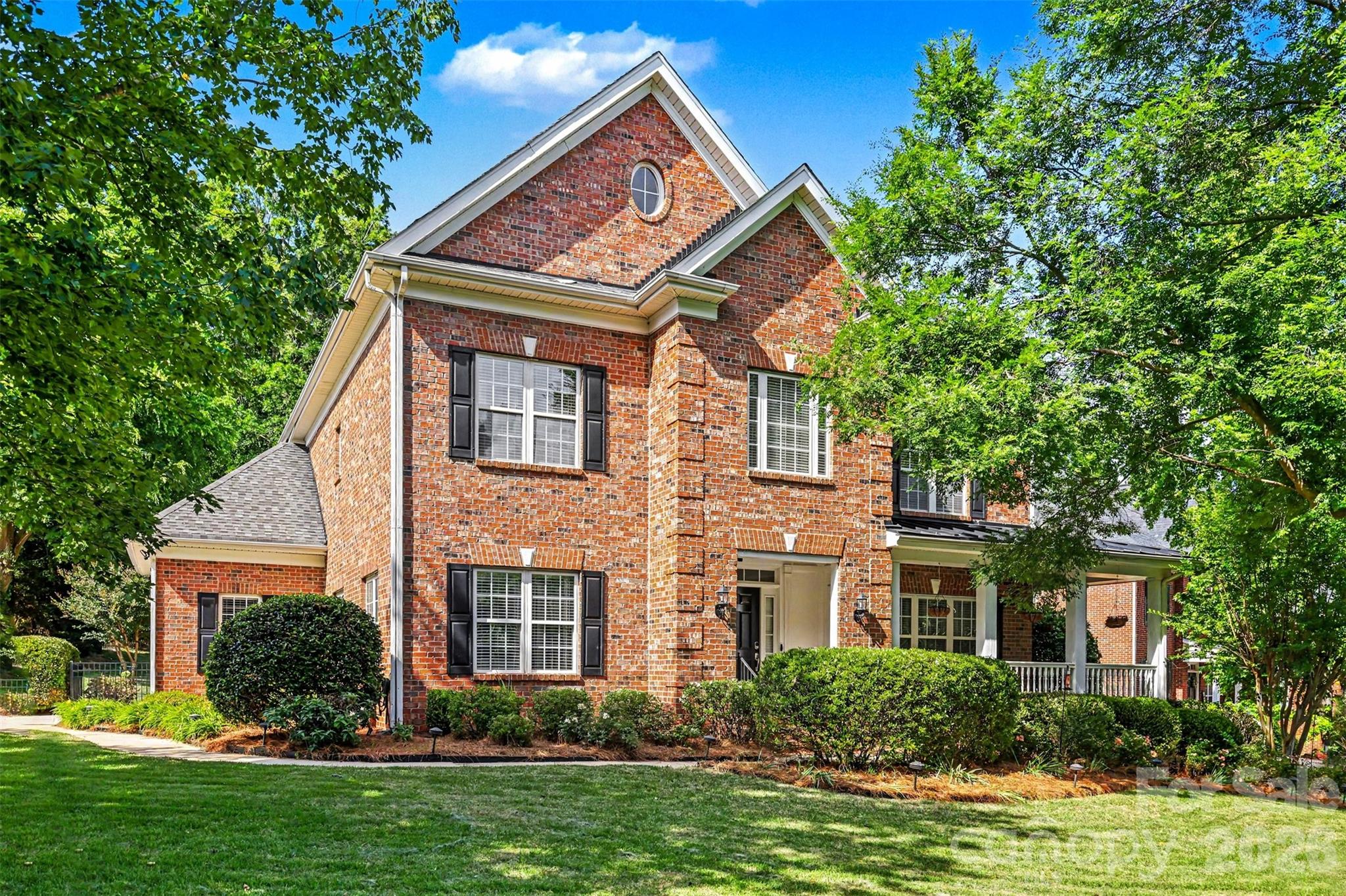 Tucked within the highly desirable and well-established community of Melbourne at Bailiwyk, this beautifully updated 3-sided brick home offers an exceptional private lot with wrap around front porch—an increasingly hard-to-find setting in today’s market.

Inside, the home features a thoughtfully designed open and functional floor plan filled with natural light and enhanced by rich hardwood floors throughout the main level. The inviting living room serves as the heart of the home, centered around a cozy gas fireplace and seamless flow into the rest of the living spaces. A stunning sunroom or private office, framed by double French doors, provides the perfect flex space for work, relaxation, or additional entertaining.

The kitchen has been beautifully transformed with custom cabinetry, quartz countertops, tile backsplash, stainless steel appliances, updated lighting, and additional pantry storage—creating both elegance and ideal everyday functionality. A refreshed main-level powder room with new vanity adds a polished touch to the main floor.

Upstairs, the spacious primary suite offers a true retreat with a fully renovated bath featuring dual vanities, a walk-in tiled shower, soaking tub, and new flooring. Secondary spaces are equally well-appointed with new carpet in the upstairs hallways, enhancing the home’s fresh and move-in-ready feel.

Outdoor living is where this home truly sets itself apart. Positioned on a lot with mature tree buffering for added privacy, the property features a beautiful wrap-around front porch, fully fenced backyard, and expansive double decks paired with generous patio space—perfect for entertaining or enjoying quiet evenings surrounded by nature. Thoughtfully designed landscaping and outdoor living areas further enhance the home’s curb appeal and livability. A spacious garage with epoxy flooring adds both function and finish.

Ideally located, Melbourne at Bailiwyk offers convenient access to I-77, Charlotte Douglas International Airport, and the vibrant shopping, dining, and entertainment scenes of Fort Mill, Tega Cay, and Carowinds—placing everyday convenience and weekend enjoyment just minutes away.

This is a rare opportunity to own a beautifully updated home on a large private lot in one of the area’s most established and convenient communities.