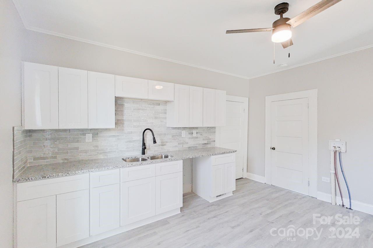 SELLER FINANCING AVAILABLE!! Beautifully renovated ranch home less than ONE MILE from downtown Rock Hill with all permits pulled!  Whether you are looking for a residence for yourself or a turn-key investment property, 109 Highland Street is the house for you!  Walking into the home, you are greeted with brand new siding and an over-sized covered porch. Continuing through the front door you will notice the new Vinyl Plank flooring and fresh paint throughout.  The large living room is the focal point to the home and gives you access to the updated kitchen with new cabinets, range/oven & fixtures with space to add a dishwasher.  The two over-sized bedrooms offer new light fixtures and large closets.  The remodeled bathroom is accessible by all rooms making the floorplan functional for any living arrangement.  The home also includes W&D hook-ups. 
Outside you will find a large level backyard with ample parking available in both the driveway and on the street.  
Don't miss this one!