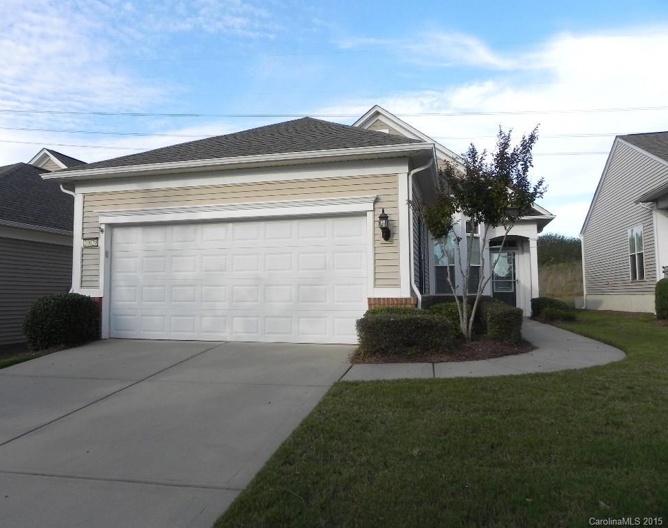 This 2BR/2BA Gray Myst features a sunroom, fenced patio and automatic awning.  The yard backs up to a berm offering privacy and green space.  The interior has stainless appliances, Corian counters, smooth top electric stove, new Whirlpool dishwasher and includes the kitchen refrigerator.  Pergo flooring throughout the living area and ceramic tile in baths and laundry. This home is move-in ready!  Come check out the community and the active adult lifestyle of Sun City Carolina Lakes.