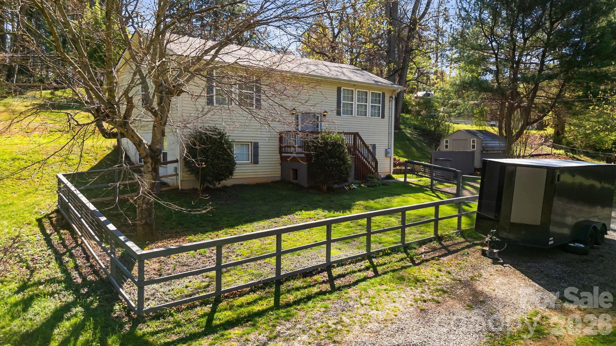 Come home to West Asheville! Versatile and full of potential, this 3-bedroom, 2.5-bath split-level home offers a unique opportunity for both homeowners and investors alike. With a separate entrance to the lower level, the layout is ideal for multi-generational living, a private mother-in-law suite, or an income-producing rental while you enjoy the upper level. Set on a generous 0.62-acre lot, the property provides space to relax and expand, with an additional 0.53 acres available for purchase. Whether you’re looking to offset your mortgage, accommodate extended family, or invest in a flexible property, this home delivers both comfort and opportunity in one smart package. See adjacent building lot with an additional .53 acres also available. Property sits just outside the city limits, so lower taxes and you may rent short term!