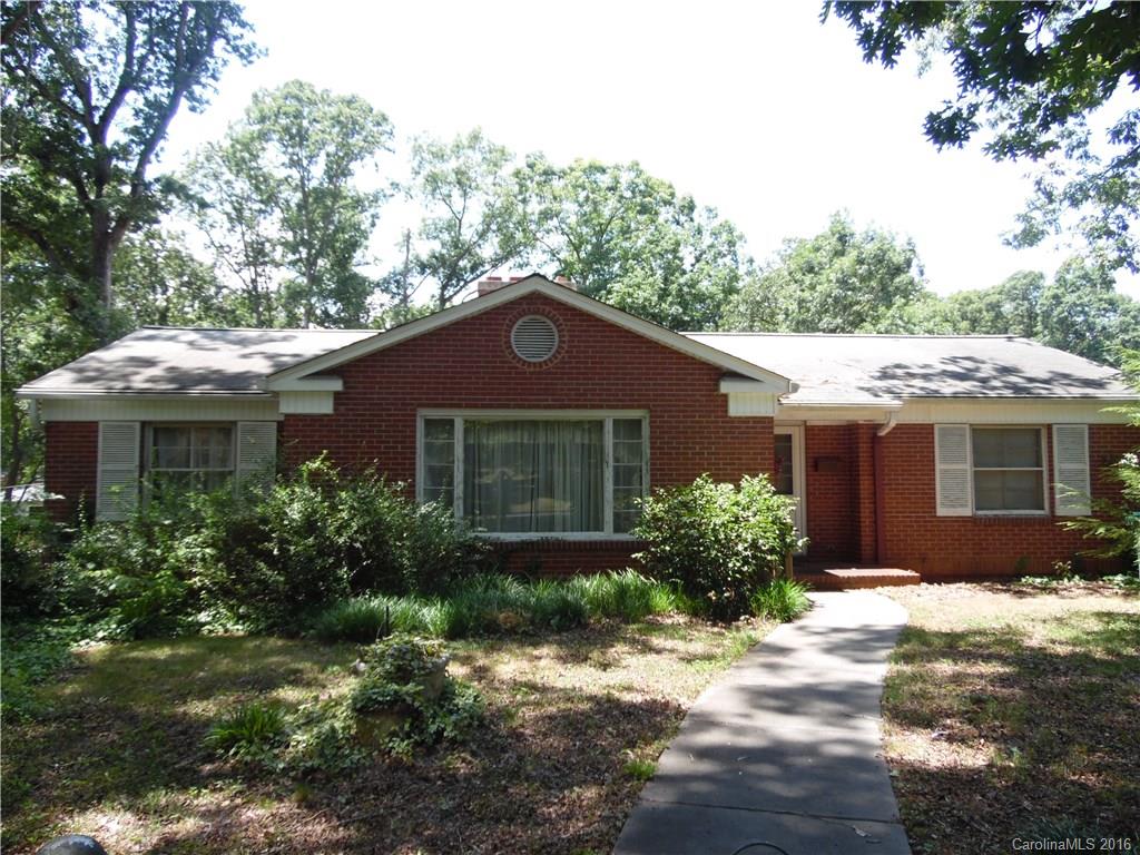 Excellent Forest Hills location - spacious living room with hardwood floors and fireplace. Heart of Pine Paneling in den or 3rd bedroom. Basement features finished bonus room with fireplace.