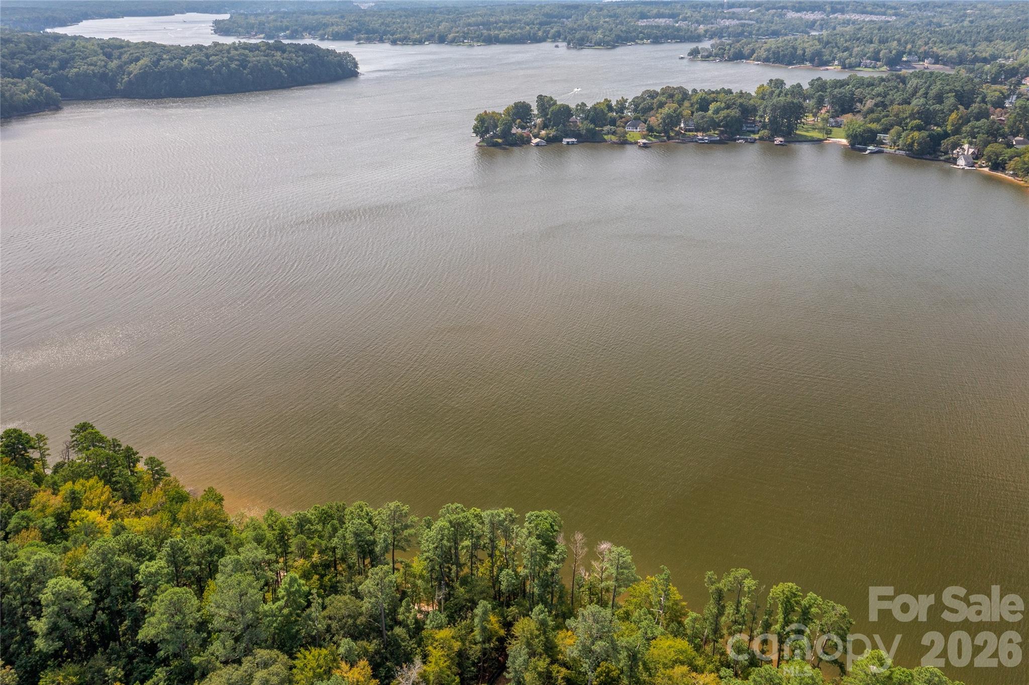 Waterfront dockable homesite in McLean South Shore in Belmont NC on Lake Wylie. Homesite 36 at 846 Lakeforest Drive, Clover SC is located on main channel with views east and south. An incredible homesite that has over 200 feet of shoreline - the homesite widens as you approach the lake! McLean South Shore offers walking trails, clubhouse, outdoor pool, fitness center, playground. Drift restaurant within walking or golf cart distance. The Carolina Thread trail along Lake Wylie located across New Hope Road. Within minutes of grocery shopping - Publix and Harris Teeter. Plus minutes from the walkable City of Belmont with its quaint vibe, festivals, park, playground, active train line - kids love watching the train, restaurants and shopping. The bustling Charlotte Douglas airport is about 15 minutes away for easy travel access. Uptown Charlotte, South Park and Ballantyne are commutable via nearby highways. Great small town location at doorstep of a bigger city! Premier waterfront community! Let's walk this incredible waterfront homesite!