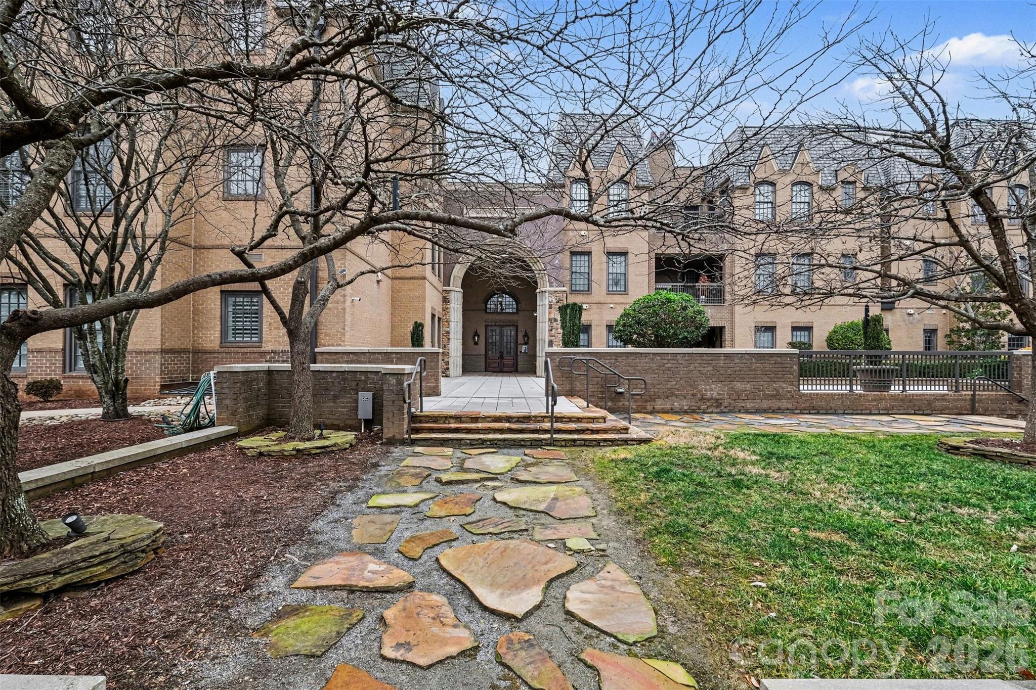 Discover elevated penthouse living in the heart of Dilworth, one of Charlotte’s most vibrant and sought-after neighborhoods. This stunning residence at Parkwood Knoll blends timeless architectural character with modern comfort, offering an exceptional lifestyle in a secure, beautifully maintained community.

Natural light pours into the home through its distinctive turret design, creating a bright and inviting living space filled with charm and architectural interest. Thoughtful custom built-ins provide both style and functionality, while a spacious laundry room with custom cabinetry adds everyday convenience.

Outdoor living is a true highlight. Enjoy your own private patio, perfect for morning coffee or relaxing evenings, along with access to an expansive shared rooftop terrace that offers additional space to unwind and entertain while enjoying the surrounding views. A gated grassy area provides a welcoming space for dogs and outdoor enjoyment, reflecting the warm, neighborly atmosphere that makes this community so special.

Residents enjoy the peace of mind of a secure building with controlled access and a gated parking garage. Two premium parking spaces are conveniently located near the elevator, and a spacious private storage unit within the garage offers valuable extra storage rarely found in condo living.

Ideally located just minutes from Dilworth’s restaurants, boutiques, parks, and Uptown Charlotte, this exceptional penthouse combines stunning design, convenience, and an unbeatable location. With a strong sense of community, wonderful neighbors, and beautifully maintained surroundings, this home offers the perfect balance of luxury and ease in one of Charlotte’s most desirable areas.