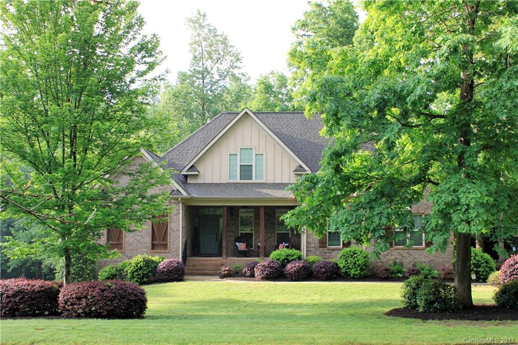 Custom, full brick home w/walkout finished basement. 5brs.  Master down w/sitting room & doors to deck. Basement w/ 10 ft ceilings,  workout room, potential media room, huge BR w/sitting area, full bath. Backyard prof landscaped w/brick patio, stepping stones to creek & trampoline. Private 1/2 acre backs to trees. Unfinished area in basement with double doors is perfect for workshop & storing lawn equipment.  Seller is licensed Realtor.
