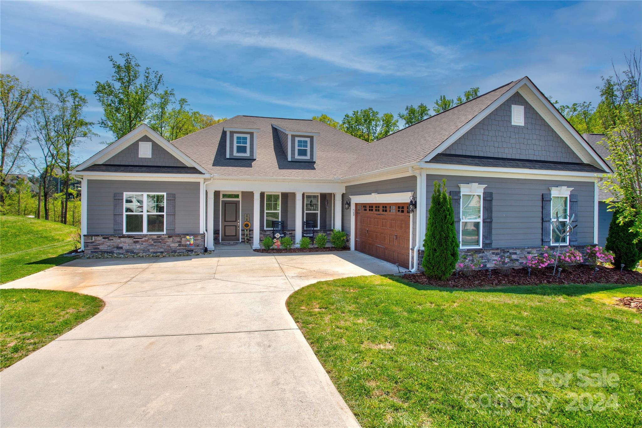 Meticulously maintained ranch in Bedford Farms w/split-bedroom floor plan-3 bed/2.5 baths.
The open floor plan flows into sunroom w/fireplace, perfect for relaxing evenings or lively gatherings. The heart of the home lies in its bright kitchen, boasting generous counter space-perfect for entertaining or indulging the home chef. 
Primary bedroom & spa like bath are tucked away for ultimate privacy.  Two addt'l bedrooms/a mother-in-law suite, with deluxe Safe Step tub.
Oversized (22x36) courtyard garage-storage solutions around every corner, ensuring that every inch of space is optimized. Attention to detail is evident throughout-exquisite coffered ceilings to the soaring 12-ft ceilings. 
Step outside into your sanctuary-20x20 covered outdoor area. Entertain guests w/built-in outdoor kitchen, against the backdrop of views/privacy. The ambiance is reminiscent of a mountain retreat, w/tongue & groove ceilings, recessed lighting, & shades.
Too many upgrades to mention!