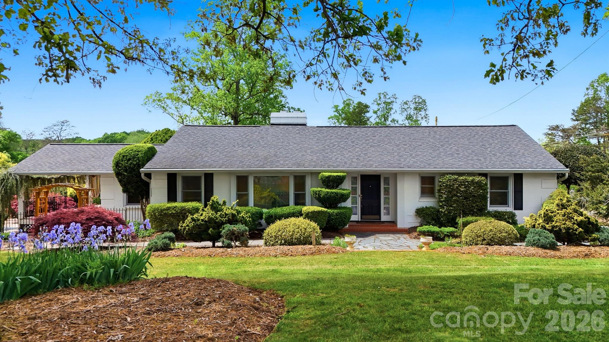 ATTENTION GOLFERS! Rare opportunity to own a home on the Catawba Country Club golf course (Donald Ross design). Built in the 1950s and thoughtfully updated over the years, this move-in ready residence sits on a meticulously landscaped 1.77-acre lot that overlooks the 12th green and 13th tee — you will love coming home to your private paradise.  Features include: fully equipped kitchen with Kitchen Aid smooth top range, Bosch dishwasher and Whirlpool refrigerator. The spacious living room has large windows and a fireplace. The floor plan includes a den with access to a side porch that overlooks the pool. 3 bedrooms 2 full baths (primary bath updated with walk-in tile shower) Double  garage plus a separate golf cart garage.......In-ground pool with solar cover (liner needs replacement). Pool house for pool equipment.  Recent updates (last 10 years): well, septic tank, HVAC system, and roof.  Mature landscaping with serene golf-course views. Lot may be subdivided.