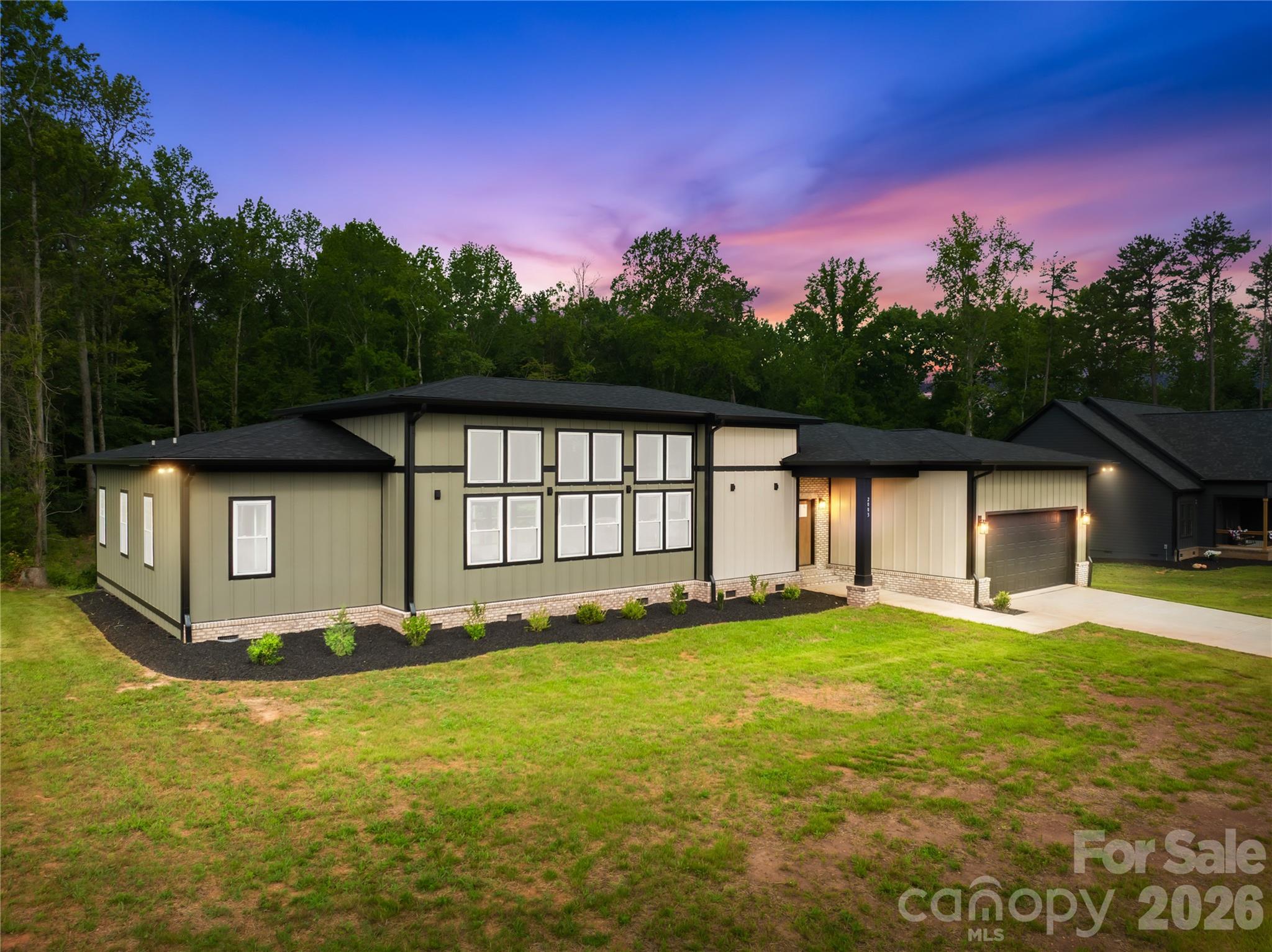 Welcome home to this stunning new construction gem! Set on a full acre, this single-story beauty offers 4 bedrooms, 3 full bathrooms, soaring ceilings and 8-foot interior doors create an airy, open feel from the moment you walk in.The heart of the home is a chef-inspired kitchen featuring a large center island with quartz counter tops, a convenient pot filler, generous cabinet storage, and a walk-in pantry, perfect for entertaining.Quartz countertops carry through into the bathrooms for a cohesive, upscale finish throughout. Step through the custom accordion-style sliding patio door off the living area onto a huge covered deck, ideal for morning coffee, evening relaxation, or hosting friends and family outdoors. The home also boasts durable fiber cement and brick exterior accents, an architectural shingle roof, and an oversized two-car attached garage with room for a workshop or extra storage. Additional features include a tile and vinyl plank flooring, a large level lot, and an electric fireplace in the living room. With quality craftsmanship, single-level convenience, and space to spare, all on a full acre lot, this home delivers exceptional value.
