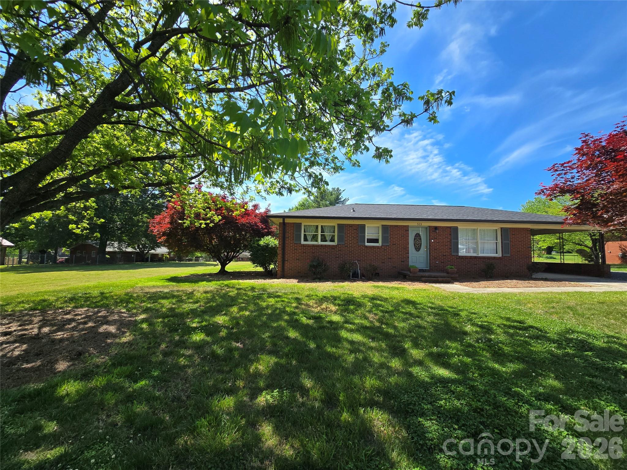ANOTHER MASSIVE PRICE ADJUSTMENT!  Home is eligible for USDA lending. Lender offering up to $4500 credit.  This beautiful, all-brick ranch is located in downtown Rockwell and features three bedrooms and two full bathrooms. The front living room has been upgraded with closets and storage, offering the option of a third bedroom or living room...your choice! The den in the back of the home has a gorgeous stove insert in the fireplace making it the perfect space to unwind and relax next to a real wood fire. Since 2022, the property has undergone several improvements, including a new roof, a moisture barrier in the crawl space, and fresh paint. The interior features original refinished hardwood floors and luxury vinyl plank flooring, while the exterior offers a large, fenced-in backyard and a storage building. Additionally, the HVAC system was replaced in 2020 according to the previous owners. Please let me know if you would like more information or if you are interested in scheduling a viewing. Realtor is related to the sellers.