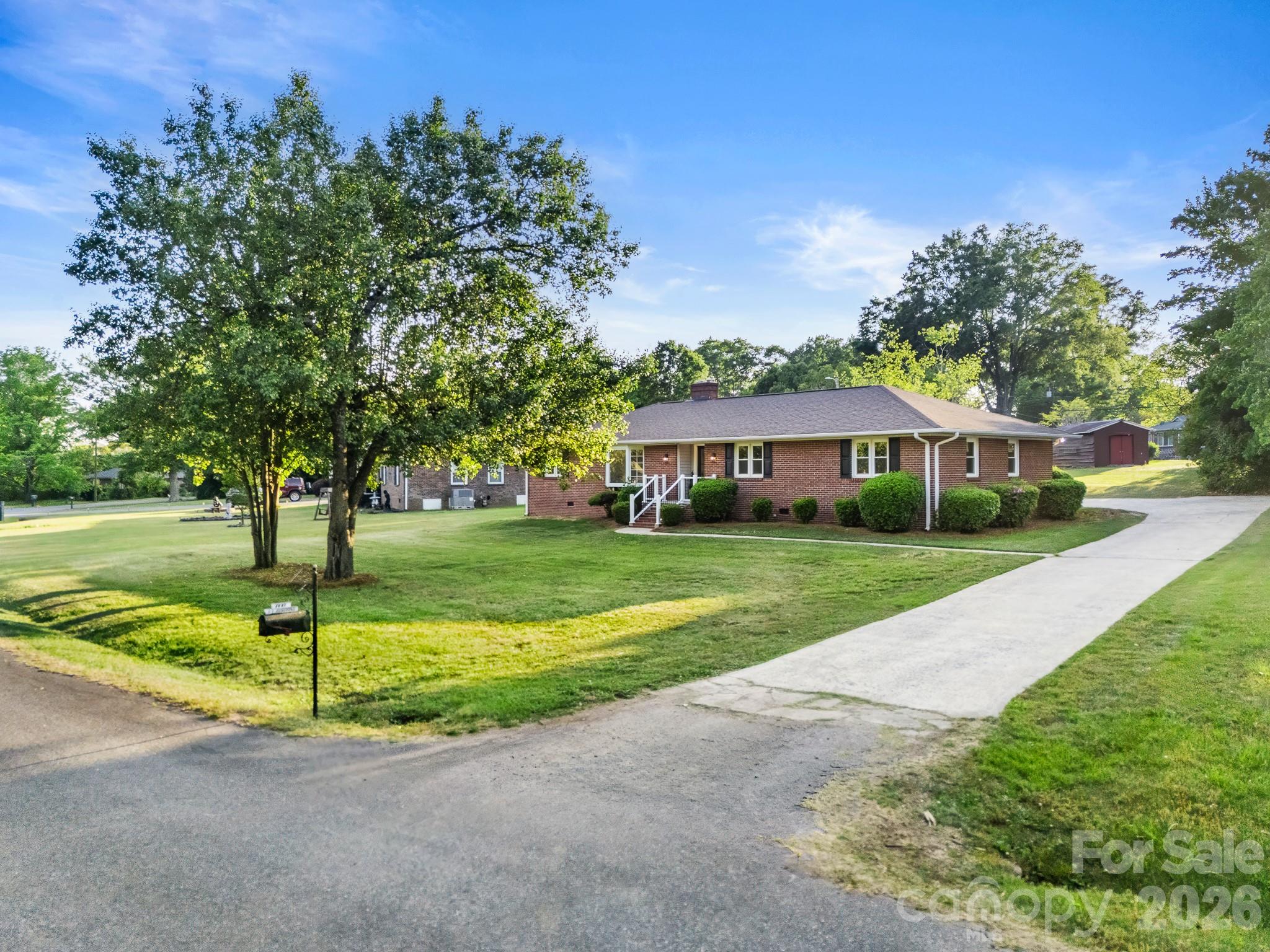 Legacy Park living at its finest! This charming 3-bedroom, 2-bath brick ranch with an upstairs bonus room offers flexible living space perfect for a home office, media room, playroom, or guest retreat. Designed for comfortable one-level living, the home features an inviting open layout, screened porch, and fenced backyard that backs to the woods, ideal for relaxing, entertaining, or pets at play. Nestled in the sought-after Legacy Park community, residents enjoy beautifully maintained amenities including walking trails, recreation areas, pools, tennis courts, playgrounds, and a vibrant neighborhood atmosphere. Located in the heart of Indian Land, this home provides convenient access to Ballantyne, Charlotte, shopping, dining, healthcare, and major commuter routes while still offering the benefit of South Carolina taxes. Indian Land is known for its rapid growth, excellent location, strong community feel, and highly desirable lifestyle, making it one of the most popular places to call home in the greater Charlotte area.