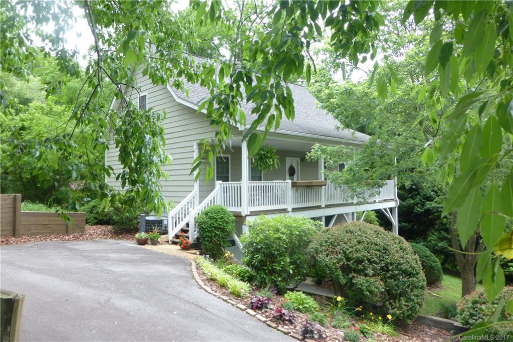 Urban Oasis in the heart of Kenilworth right next to the Park. Approx. 1 mile to Downtown Asheville, Mission Hospital and the Asheville mall. Move-in condition,1st floor master suite,spacious kitchen,wood floors,gas fireplace,large family room w/patio in lower level.Just under half an acre awaits your extremely private home. Enjoy rocking chair front porch or the large rear deck overlooking your large yard. Attached garage for your Car, Bikes and tools!