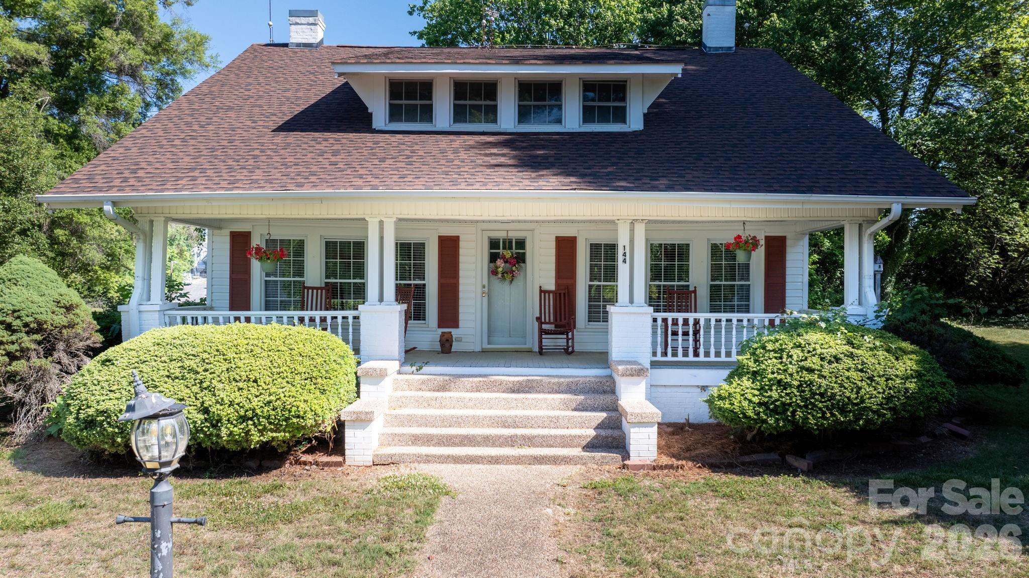 Discover the perfect blend of character and opportunity in Stony Point. Built in 1945, this 4-bedroom, 3-bathroom home spans 2,365 square feet on a spacious lot. From the welcoming covered front porch to the original hardwood flooring and classic layout, this property offers a timeless structural soul that you just can't replicate in new builds. 

The interior showcases bright, flexible living spaces, with an open kitchen layout that flows into the living room with multiple large windows. The home feels grand and spacious with the extra height you gain from the 9' ceilings. While it retains its vintage appeal, major peace-of-mind upgrades have already been taken care of—including a HVAC system installed in 2024.Outside, the expansive yard offers plenty of mature shade trees, a large detached storage building/workshop, and a paved driveway with ample parking. 

Bring your design ideas to unlock this property's full potential and create your ultimate dream home or a lucrative investment. Don't miss the chance to own a piece of Stony Point history with a head start on modern comfort. Schedule your tour today!