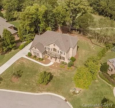 Amazing Open Estate with Inspiring Golf & Water Views on Cul-de-Sac + Great Entertain & Living Spaces, including Finished Lower Level-the Perfect Package for your Daily "Staycation" & Creating Life Memories! NEW-Roof/Upstairs Carpet/Fresh Paint/Appliances/Clark Ironworks Door, Refinished Hardwoods & Much More! Dramatic Curved Staircase, Great Room with Abundant Light from Window Wall Opens to Kitchen. Bedroom/Office on Main. Surround Sound, Fenced Yard. Near Ballantyne & Blakeney. Low SC Taxes.