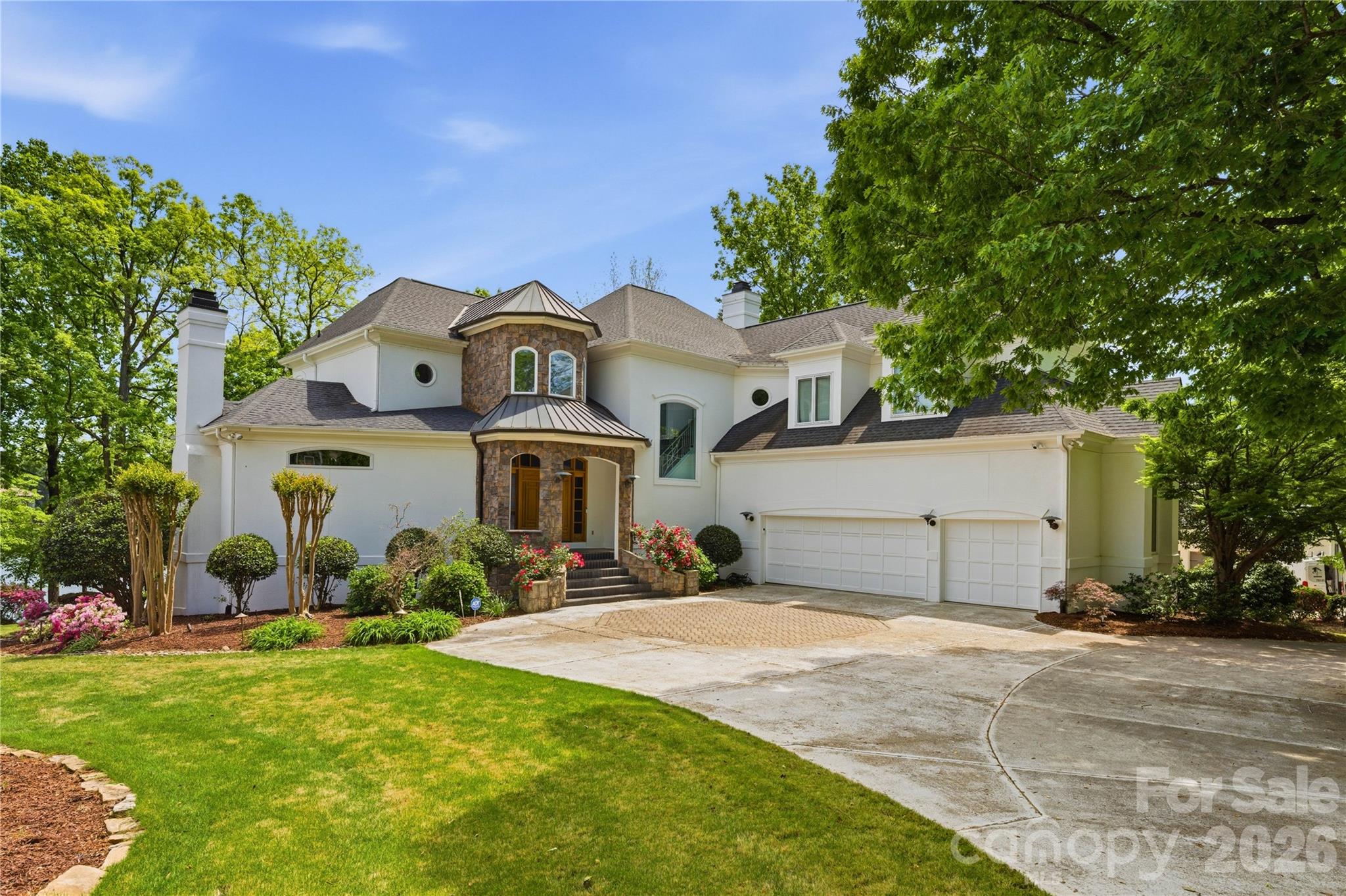 Waterfront home with a private dock on one of the most prestigious and quietest streets in the Peninsula. Immaculately maintained, this home awaits your personal touches. A European Contemporary with an open floor plan that leads to a terrace with water views and outdoor kitchen and dining. An amazing property but needs a little vision to make it your own lakefront slice of heaven. Preliminary pool approval from the HOA and room for expansion on the lower level. 3 car garage with hydraulic lift. A very short distance to the Peninsula Club (separate membership required) featuring golf, tennis, pickleball, swimming and fine dining. All amenities are a short distance away and downtown CLT and the airport just 35 minute drive away.