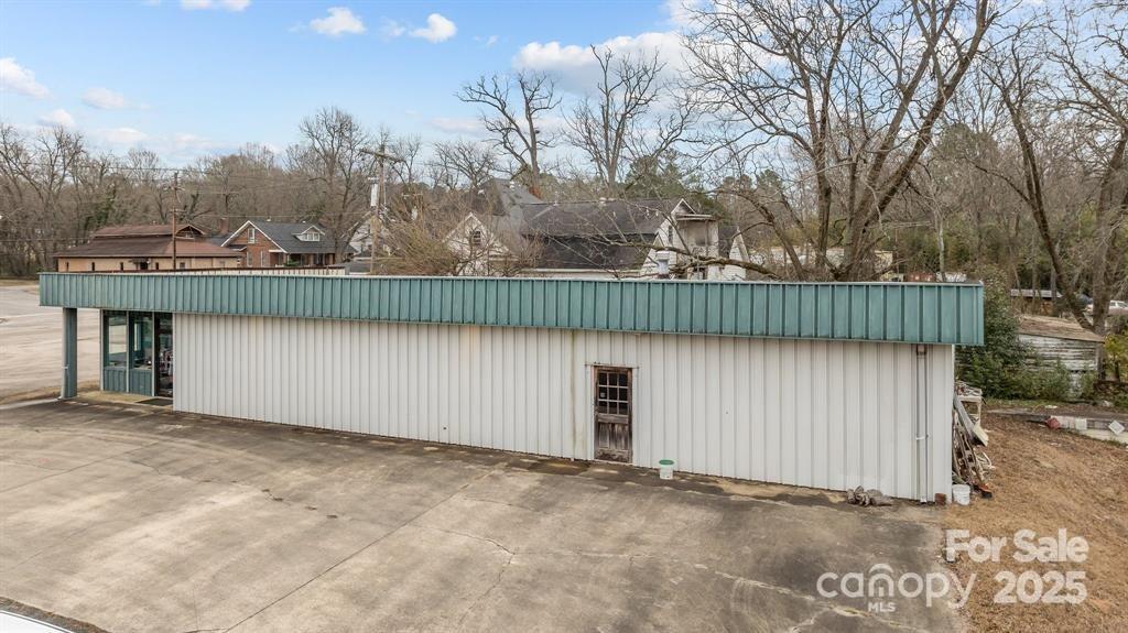 Centrally located just off I-77 between Charlotte, NC and Columbia, SC. Less than an hour to Charlotte Douglas International Airport and just under an hour to Columbia, SC.  This business location is minutes from up and coming down town Chester, SC, and is on a corner lot with over half an acre of land for your new venture. The building is over 3,200sf and offers a lot of potential. A large showroom, two office spaces, large kitchen, two bathrooms, a utility room, and a shipping and receiving dock out the back of the building. Additionally, all can be modified to local zoning requirements.