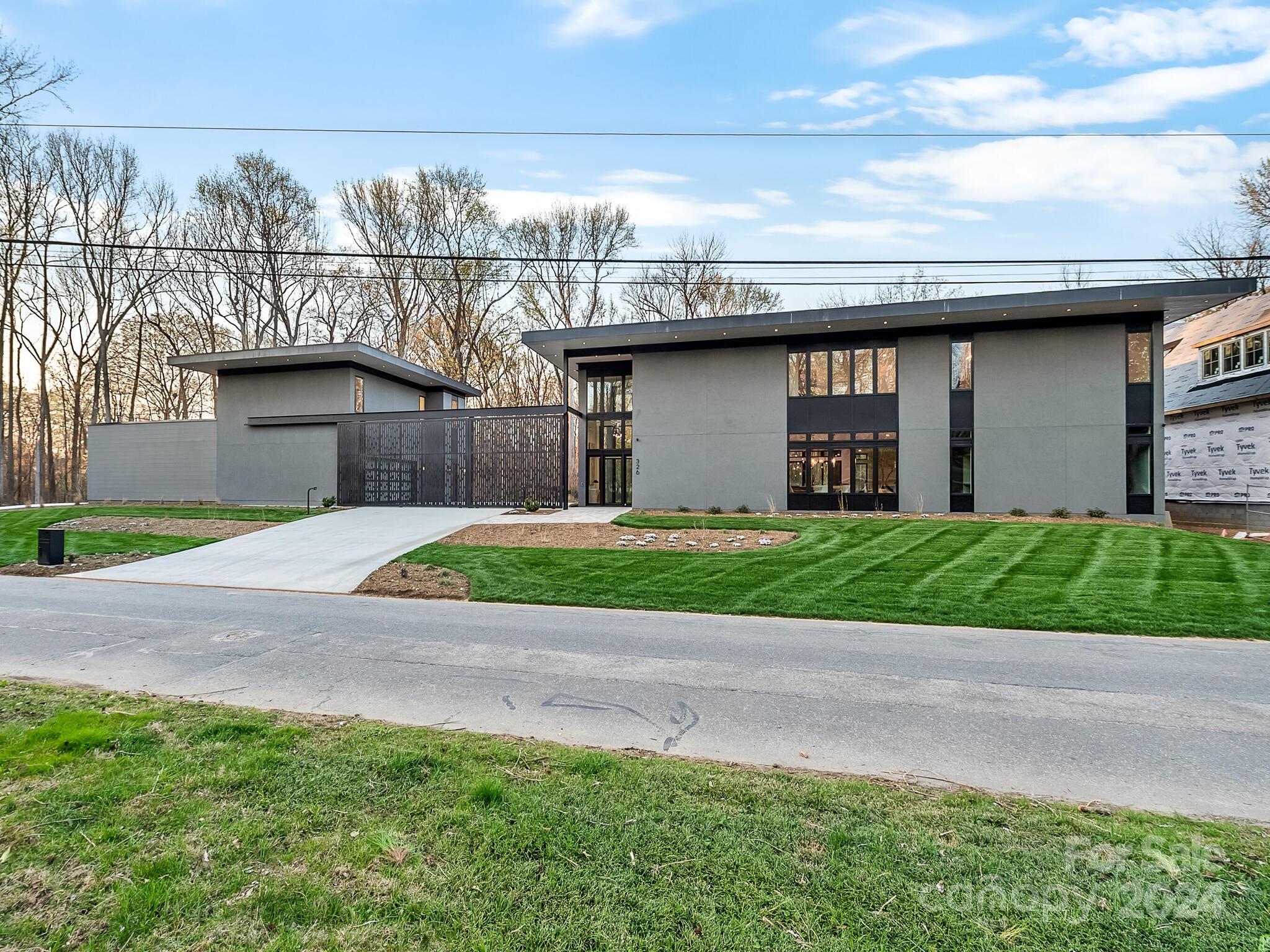 Experience modern living at its finest. This new construction home built by Halley Douglas and located in Eastover, backs up to the Eastover Nature Preserve. With 4 bedrooms, 4 1/2 baths in the main house and a secondary living space and bath over the detached garage. Enter the dramatic foyer with floor to ceiling windows and into an open floor plan featuring abundant natural light. Top of the line gourmet kitchen features beautiful custom cabinetry, double islands with quartz countertops, Wolf 6 burner gas range, Subzero fridge, Sharp microwave drawer. Kitchen opens to a gracious family room surrounded by windows overlooking outdoor porch, pool and firepit. Private study/office. Guest suite on main. Second level offers gorgeous primary suite with luxury bathroom with heated floors & spacious custom closet. Two secondary bedrooms up with two bathrooms and bonus. Huge laundry room. High-end designer finishes throughout. Three car drive through garage with epoxy floor. Exceptional home!