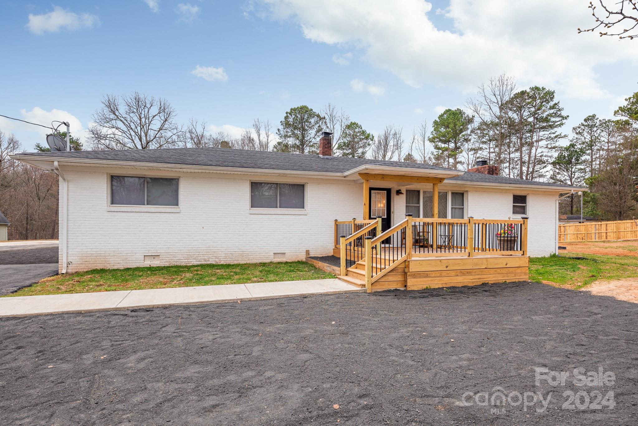 Step into this meticulously renovated 1964 full brick ranch on just under an acre, where luxury meets comfort at every turn. Luxury vinyl plank flooring spans the entirety of this home, complemented by sleek quartz countertops and state-of-the-art stainless steel appliances. Enjoy a harmonious blend of modern elegance and inviting warmth throughout.
The main residence boasts a thoughtfully converted layout, now offering 2 bedrooms and 2 bathrooms alongside generous living areas. But the surprises don't end there – discover a fully permitted 2-bedroom, 1-bathroom guest house nestled on the property.   This allows for comfortable multifamily living arrangements and great investment potential.
Don't miss out on the opportunity to experience this remarkable property firsthand. Schedule your showing today and prepare to be captivated by its timeless charm and contemporary allure.
