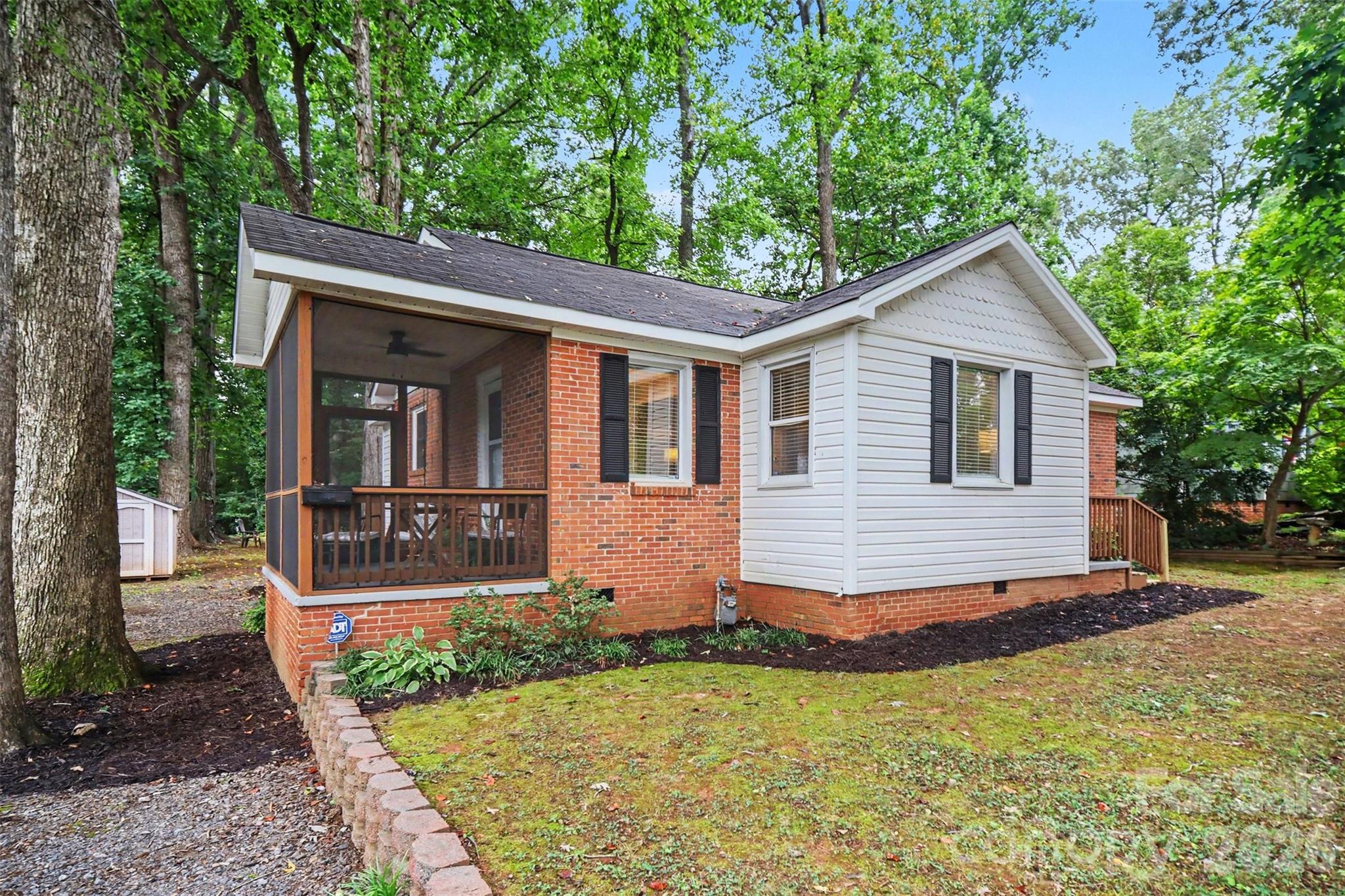 Located in the Whiteville Park neighborhood, 406 Nims Street places you in the center of everything Fort Mill has to offer. Enjoy easy access to vibrant downtown Fort Mill, known for its locally owned restaurants, coffee shops, breweries, boutiques, and year-round community events. Featuring 3 bedrooms and 1 bath, this well-maintained home showcases beautiful hardwood floors, a bright and functional layout, and thoughtful updates throughout. Situated on a spacious, tree-lined lot, the property includes a screened-in side porch, mature landscaping, and a detached storage building. Outdoor enthusiasts will appreciate the home's proximity to several parks, the Anne Springs Close Greenway, and numerous recreational amenities. Commuters benefit from convenient access to I-77, making travel to Charlotte, Ballantyne, and surrounding employment centers effortless. Whether you're a first-time homebuyer, downsizing, or looking for an investment opportunity, this inviting home delivers comfort, charm, and an unbeatable location.