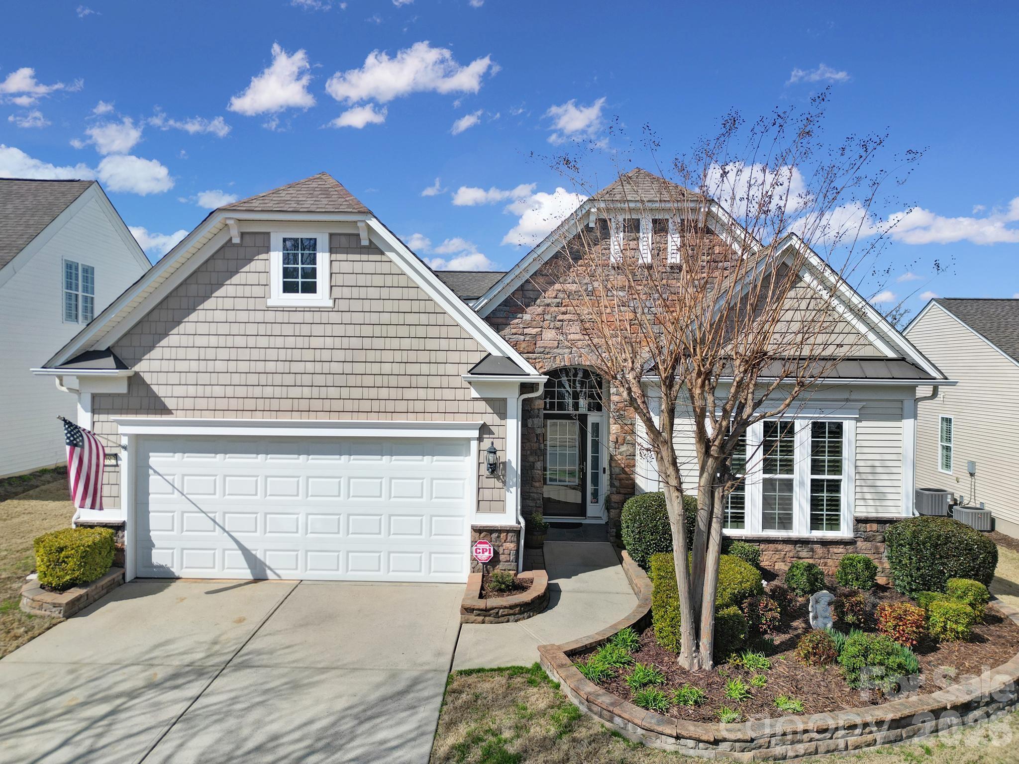 Popular Willow Bend floor plan in the highly sought-after 55+ community of Sun City Carolina Lakes, known for its exceptional resort-style amenities, public golf course and vibrant active-adult lifestyle.

Beautiful custom landscaping creates inviting curb appeal, while floor-to-ceiling windows surrounding the front door fill the entry with natural light. Just off the foyer, the well-appointed kitchen features granite countertops, stainless-steel appliances, roll-out cabinets, an island with seating, a breakfast nook, and a convenient computer niche. A charming breakfast window connects the kitchen to the dining area, highlighted by a stylish hanging chandelier.

The living room serves as the heart of the home, anchored by a gas log fireplace and enhanced by elegant picture frame molding accents. Oversized windows provide a seamless visual connection to the 3-season room, complete with a ceiling fan - the perfect spot to relax year-round.

The spacious primary suite offers a tray ceiling and a private ensuite bath featuring a garden tub, glass-enclosed shower, dual-sink vanity, and walk-in shower. At the front of the home, double doors open to a dedicated office or study, ideal for working from home or pursuing hobbies. A generous guest bedroom with access to a full hall bath provides comfortable accommodations for overnight visitors.

Step outside from the 3-season room onto the deck overlooking the backyard, creating a peaceful outdoor retreat perfect for entertaining or enjoying quiet mornings.

Additional notable features include a new furnace (2025) and A/C unit (2022).

This thoughtfully designed home combines comfort, functionality, and style in one of the area's most desirable active-adult communities.