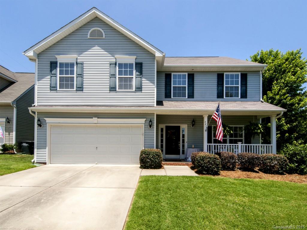 Spacious and Beautiful Cul-de-sac home with rocking chair front porch. Three bedrooms Plus a LOFT AND a basement. The basement has a private office, full bathroom,rec-room and bar with sink and refrigerator hookup. PERFECT for entertaining! Upgraded Kitchen with granite countertops, 42" cabinetry and island. Large master suite with 5 piece bath and his/hers closets. Private yard backs to woods. Easy access to Tega Cay walking trails, parks, lake and top rated brand new elementary school.