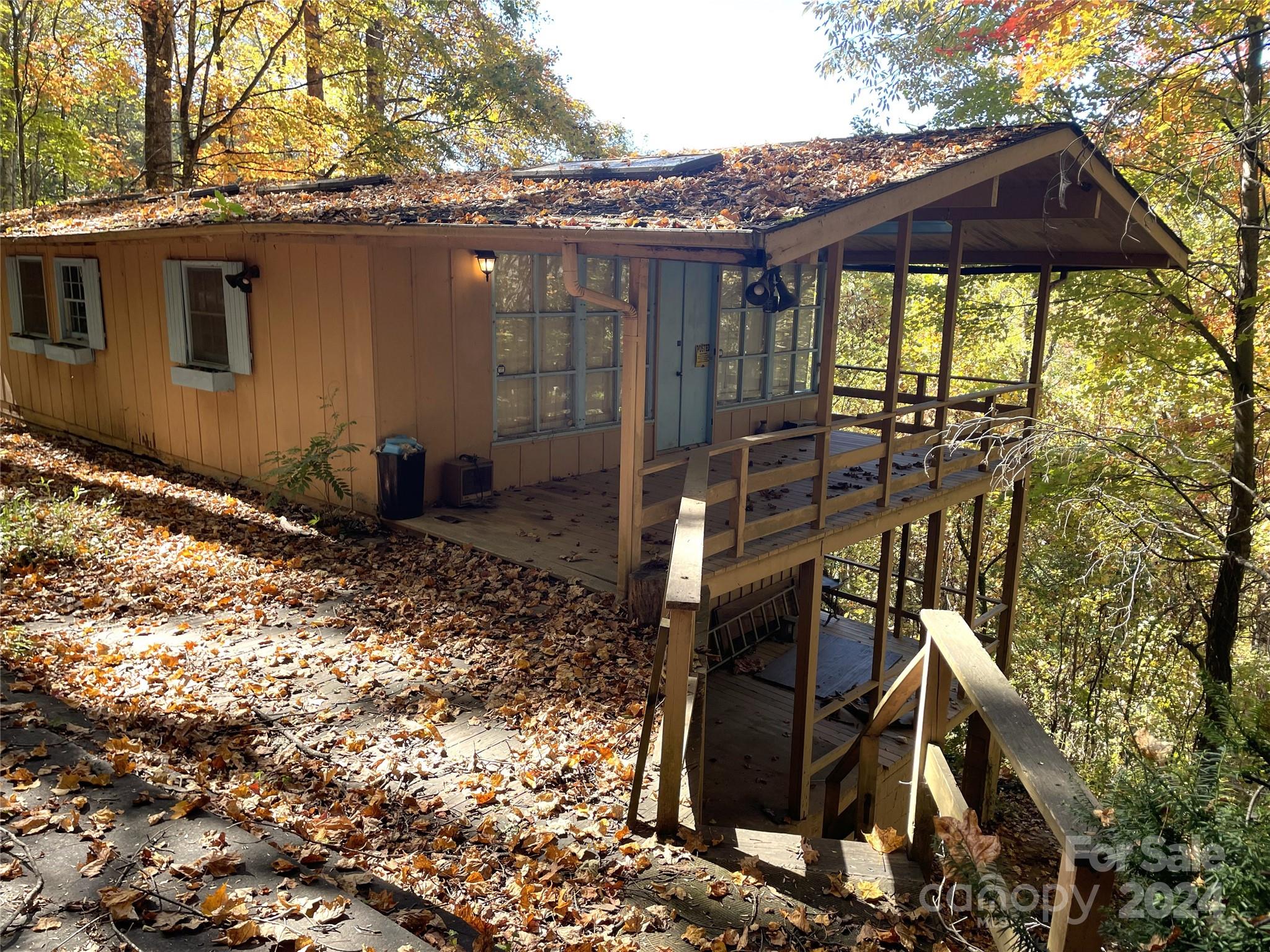 Discover the charm of mountain living at 1728 Cabin Flats Road! Nestled on just over an acre of serene, wooded land, this 3-bedroom, 2-bath home offers a warm and inviting atmosphere that makes it ideal as a family retreat or a year-round residence. This unique property includes a second living quarters with its own kitchen, perfect for hosting guests or as a private in-law suite.

Formerly a cherished family getaway, this home is ready for its next chapter. Imagine gathering around the fireplace on cool Carolina nights, or enjoying the natural surroundings on quiet mornings. While it may need a touch of TLC, this property has endless potential to become the mountain home of your dreams.

If you’re looking for a peaceful retreat with room for the whole family to enjoy the stunning Carolina mountains, look no further. With its versatile layout and scenic location, 1728 Cabin Flats Road is waiting to welcome you home. Don’t miss the chance to make this charming property your own!