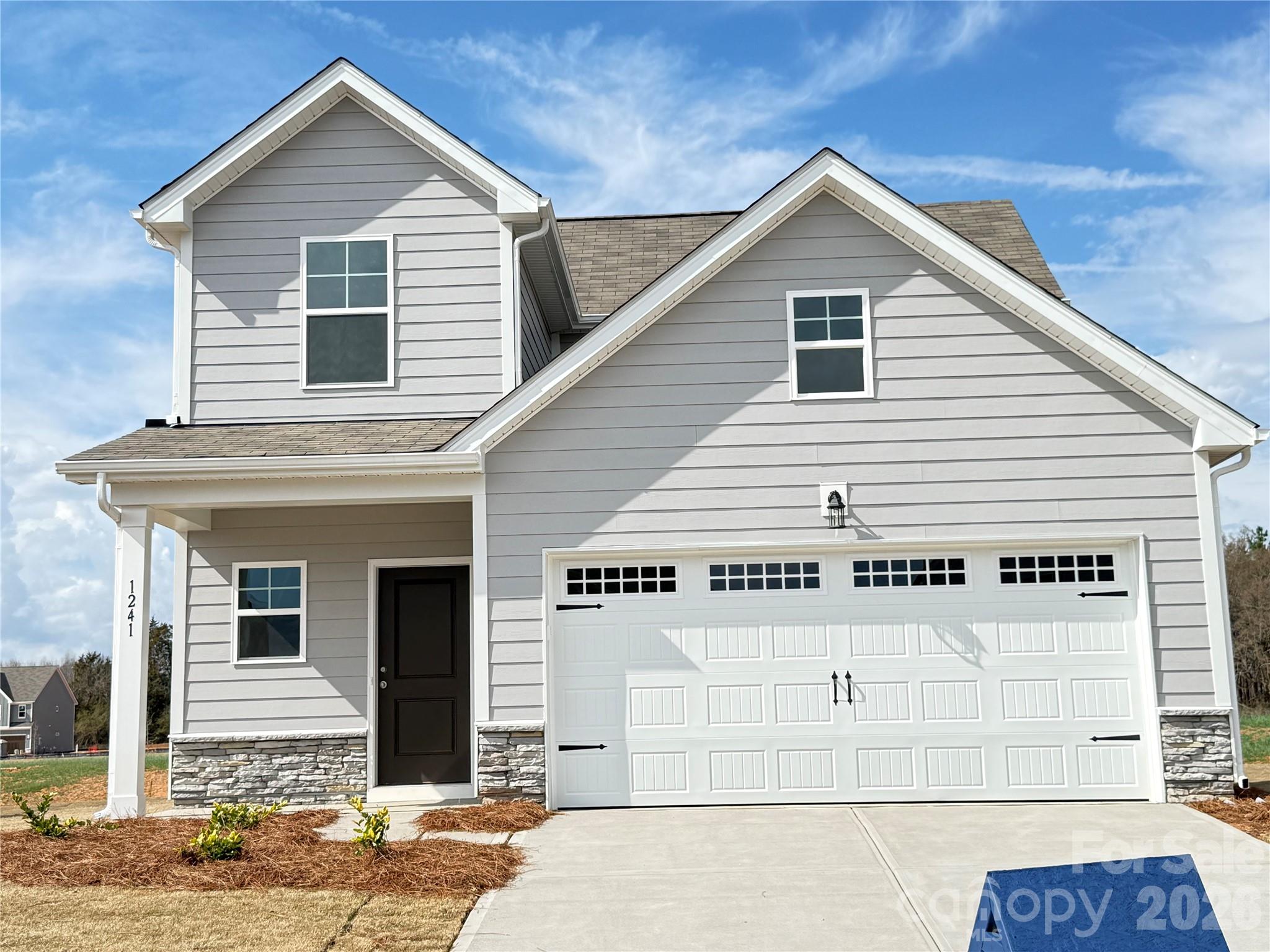 Welcome to this beautiful new construction home featuring 3 bedrooms, 2.5 baths, and 1,738 square feet of thoughtfully designed living space. The primary suite is conveniently located on the main level, along with the laundry room for added everyday convenience. The open-concept kitchen overlooks the main living area and features granite countertops, subway tile backsplash, and ample cabinetry—perfect for entertaining or daily living.

Upstairs offers additional bedrooms and flexible space for family or guests. Enjoy living in a community that offers a future pool amenity and generous spacing between homes, providing both comfort and privacy.

A wonderful opportunity to own a stylish, low-maintenance home in a growing community.
