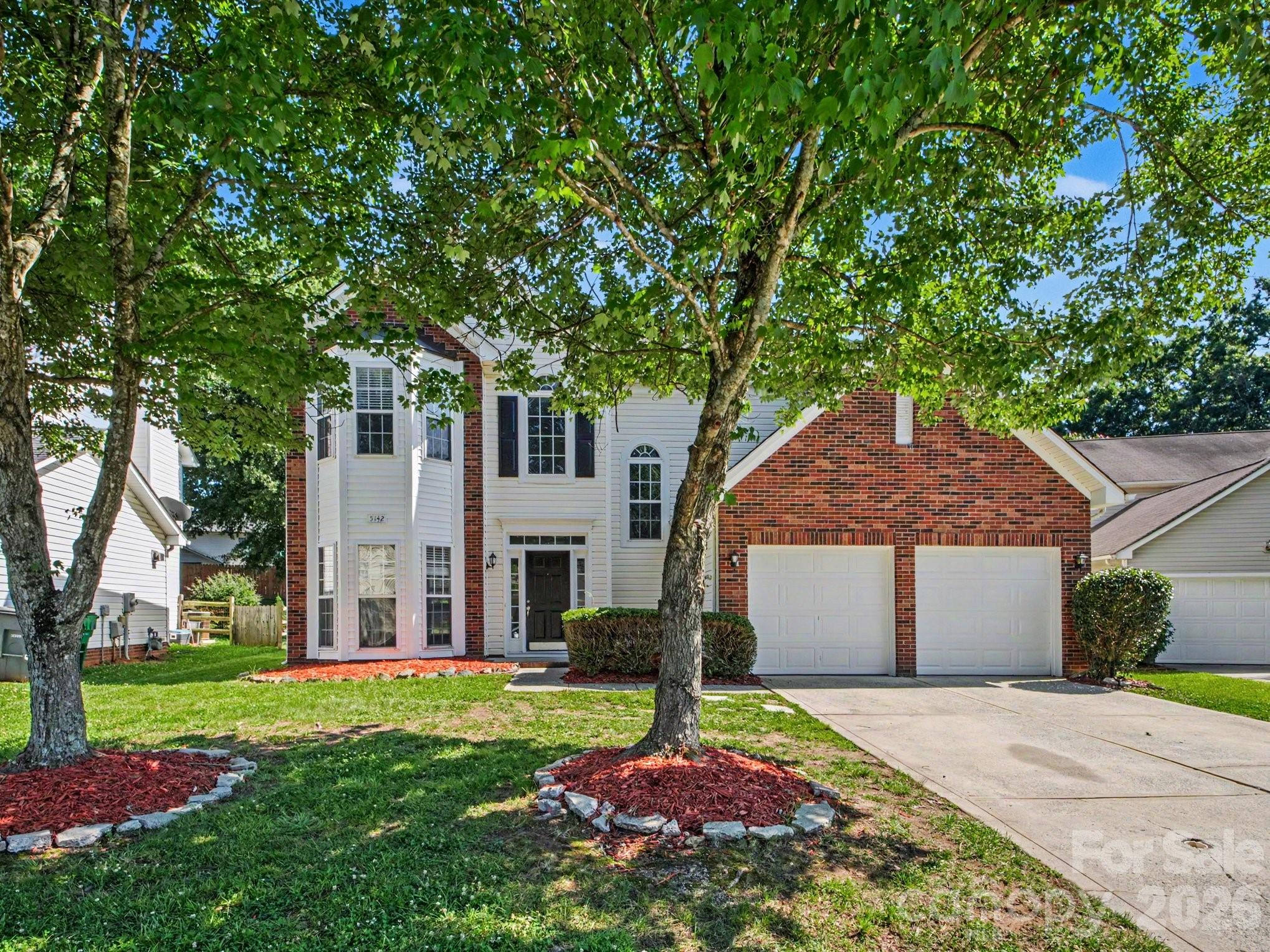 This 4-bedroom, 2.5-bathroom home makes a grand first impression with soaring high ceilings at the entry, creating an immediate sense of light and space. The interior is defined by its architectural character, featuring elegant bay windows and oversized windows throughout that flood the living areas with natural light. The heart of the home is anchored by a cozy fireplace, providing a warm focal point for the main living zone. While the home boasts impressive bones and a functional layout, including an attached two-car garage, it requires some repairs to restore its full luster. This property represents a fantastic opportunity for a buyer or investor to modernize a home with high-end architectural features and build significant equity in the process.