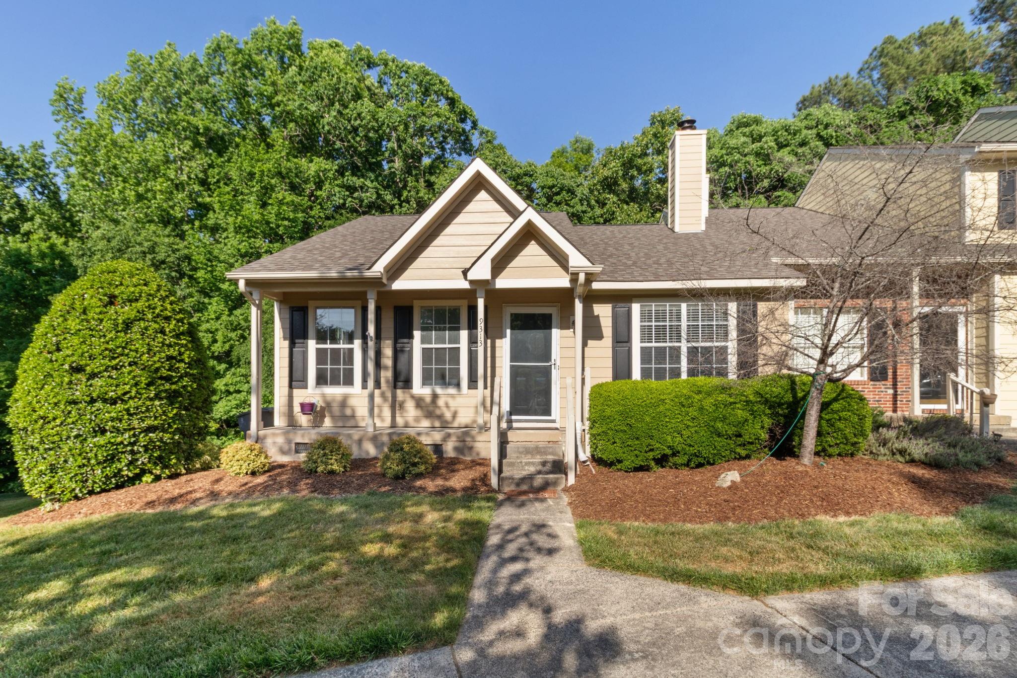 End unit townhome! This quaint community is close to everything yet tucked away and private. freshly painted 2 bedroom 2 bath with functional floorplan. Kitchen with breakfast area overlooking deck and trees. Wood laminate flooring in main areas. Cozy fireplace in great room for added ambience. storage closet out back for additional storage and a large crawl space. Complete with refrigerator, washer and dryer.  Community offers a pool, clubhouse and pond. 2 dedicated parking spots. Close to Waverly, Arboretum, Stonecrest, Blakeney, Promenade and 485. HOA covers landscaping, water, sewer. Raintree Country Club membership available for a fee.