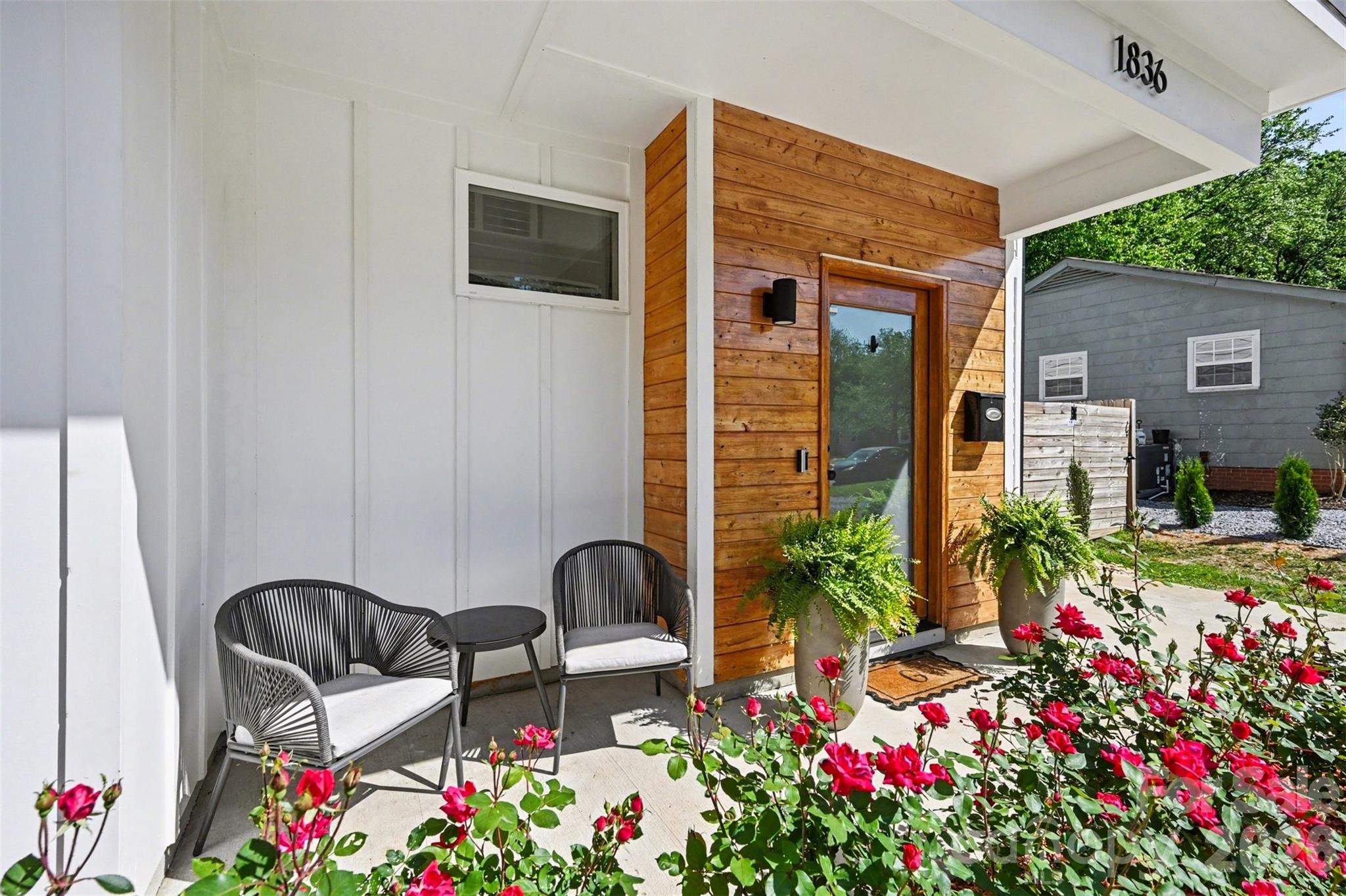 This striking contemporary home blends modern design with thoughtful, high-end finishes, creating a space that feels both elevated and inviting from the moment you arrive. The clean architectural lines and curated landscaping set the tone, while a welcoming covered entry with warm wood accents adds an immediate sense of style and intention.

Inside, the home opens into a bright, airy layout filled with natural light and upscale touches throughout. Wide-plank flooring flows seamlessly across the main living areas, complemented by a soft, neutral palette and designer lighting that enhances the home’s modern aesthetic. The kitchen is a true centerpiece, featuring an oversized island with seating, sleek cabinetry, and a polished, open design that connects effortlessly to both the dining and living spaces—ideal for entertaining or everyday living.

The attention to detail continues upstairs, where the primary suite offers a refined retreat with generous proportions, a custom walk-in closet, and a spa-inspired bath complete with dual vanities, elevated finishes, and a beautifully tiled walk-in shower. Secondary bedrooms are equally well-appointed, while additional spaces provide flexibility for a home office, guest rooms, or creative use. The laundry room is thoughtfully designed with built-in storage, adding both convenience and style.

Outdoor living is just as impressive, with a fully fenced backyard designed for both relaxation and entertaining. A spacious patio creates the perfect setting for gatherings, while the private yard offers plenty of room to unwind in a serene, tree-lined setting.

Located in the sought-after Eastwood area of Charlotte, this home places you just minutes from Plaza Midwood, NoDa, and Uptown, offering easy access to some of the city’s best dining, shopping, and entertainment. Enjoy the charm of an established neighborhood paired with the convenience of nearby urban amenities, making this an exceptional opportunity to experience modern living in one of Charlotte’s most vibrant and connected locations.