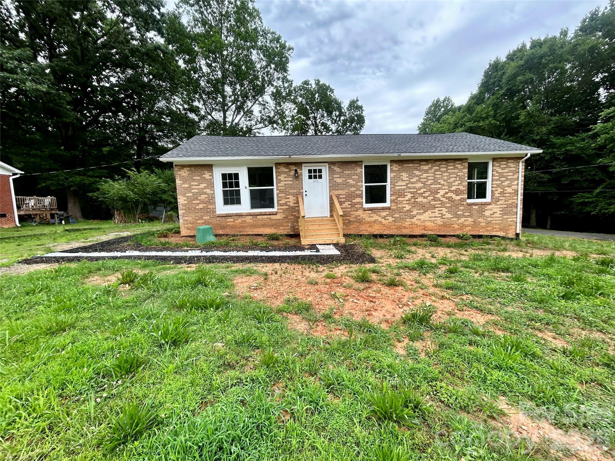 Get ready to fall in love with this beautifully remodeled brick home situated on 0.33 acres with NO HOA!
Property Features:
• 5 Bedrooms
• 2 Full Bathrooms
• Beautifully Remodeled Interior
• Finished Basement
• Brick Exterior
• Spacious 0.33-Acre Lot
• No HOA Restrictions
This home offers incredible flexibility with a finished basement that can serve as a private suite for guests, in-laws, or anyone looking for their own separate living space while still being connected to the home. It's the perfect setup for multi-generational living, a guest retreat, home office, or entertainment space.
Enjoy the Best of Both Worlds
Nestled in a peaceful rural setting, you'll enjoy privacy, space, and freedom without HOA restrictions while still being conveniently close to everyday essentials.

Nearby Shopping & Convenience
Just minutes away from local shopping options including Food Lion, Dollar Tree, Family Dollar, Stanley MarketPlace, Grocery Warehouse, and more.
Local Dining & Entertainment
Enjoy hometown favorites such as Main Street Social and Sweet Shananigans, along with other local restaurants, coffee shops, and conveniences located near downtown Stanley.

Excellent Location for Commuters
• Approximately 7 minutes to NC Highway 27
• Approximately 10–15 minutes to NC-16
• About 30–35 minutes to Uptown Charlotte
• Convenient access to Denver, Mount Holly, Lincolnton, and Charlotte
Whether you're looking for room to grow, space for extended family, or simply want a beautifully updated home with easy access to everything you need, 400 Ponderosa Rd delivers comfort, convenience, and value.
Interested in touring this home?