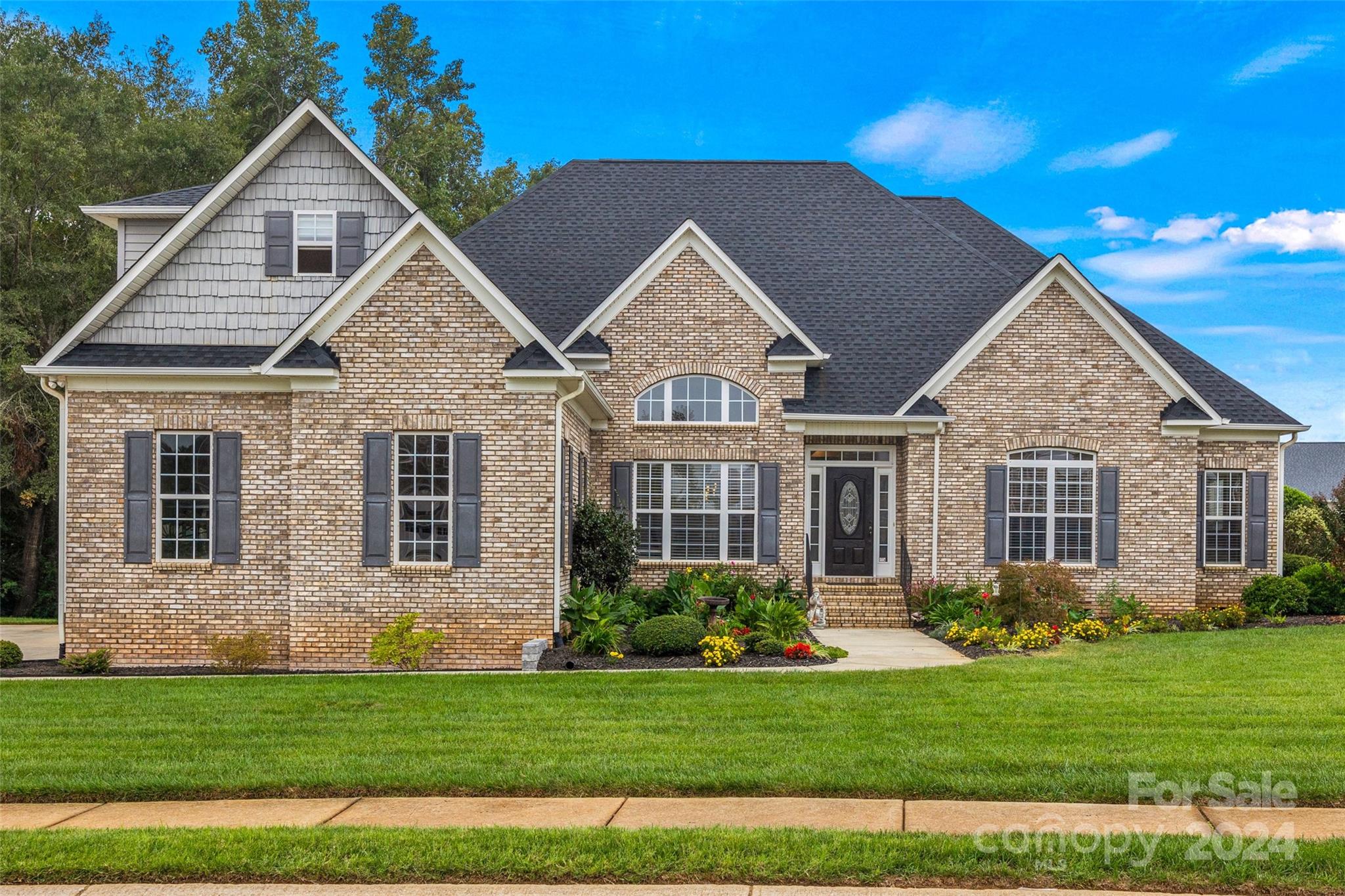 This meticulously maintained home is one that you must see.  You are welcomed by the formal dining space with crown molding, decorative pillars and high ceiling on one side with flex office space on the other.  As you continue through the home you will find trey ceilings, crown molding throughout and hardwood floors.  The kitchen boasts upgraded cabinetry with granite countertops and under cabinet lighting. This split floor plan is a perfect layout to allow a family to have privacy or guests to feel right at home.  All tile in the home is 18x18 ceramic tile which you will find in each bathroom and the laundry room.  The oversize primary suite offers a huge sitting area as well as a walk in closet off the on-suite bath.  As you step out onto the back screened in porch you are invited to a huge entertaining area surrounding an in-ground saltwater pool and hot tub.  The backyard is fully fenced and has underground irrigation. Don't miss your opportunity to see this beautiful home.