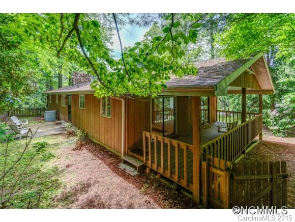 Immaculately maintained contemporary with new kitchen countertops and ss appliances.  Gorgeous lot with rolling yard and wooded area at the rear of the property and small stream.  3/2 Upstairs with a bedroom, bath, bonus, and family room in the basement. Master bathroom could easily be enlarged into the walk-in closet area.  Covered porch and rear patio with a 2 car basement on the lower level.
